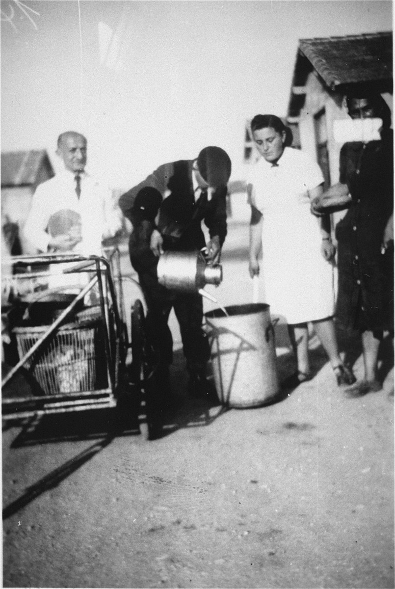 Members of "Le Comite" help the OSE distribute food to prisoners in the Rivesaltes transit camp.

"Le Comite" was a group of prisoners who helped to implement the medical and social assistance programs of the OSE relief agency in the Rivesaltes transit camp.