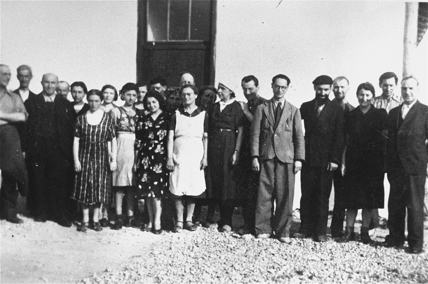 Members of "Le Comite," a group of prisoners who aided the OSE in Rivesaltes.

Those pictured include Erwin Heilbronner (fourth from right) and his wife Flora Heilbronner (fifth from left).