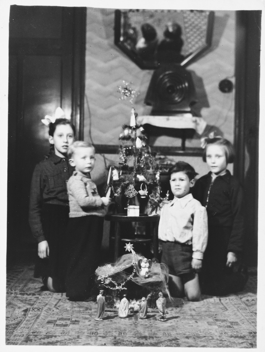 Norbert Obstfeld celebrates Christmas at the home of his rescuers, Raymond Verhage and Julia Verhage-Leenknecht.

Pictured from left to right are: Raymonda Verhage, Etienne Delobelle, Norbert Obstfeld and Jacqueline da Cunha (Norbert's cousin).