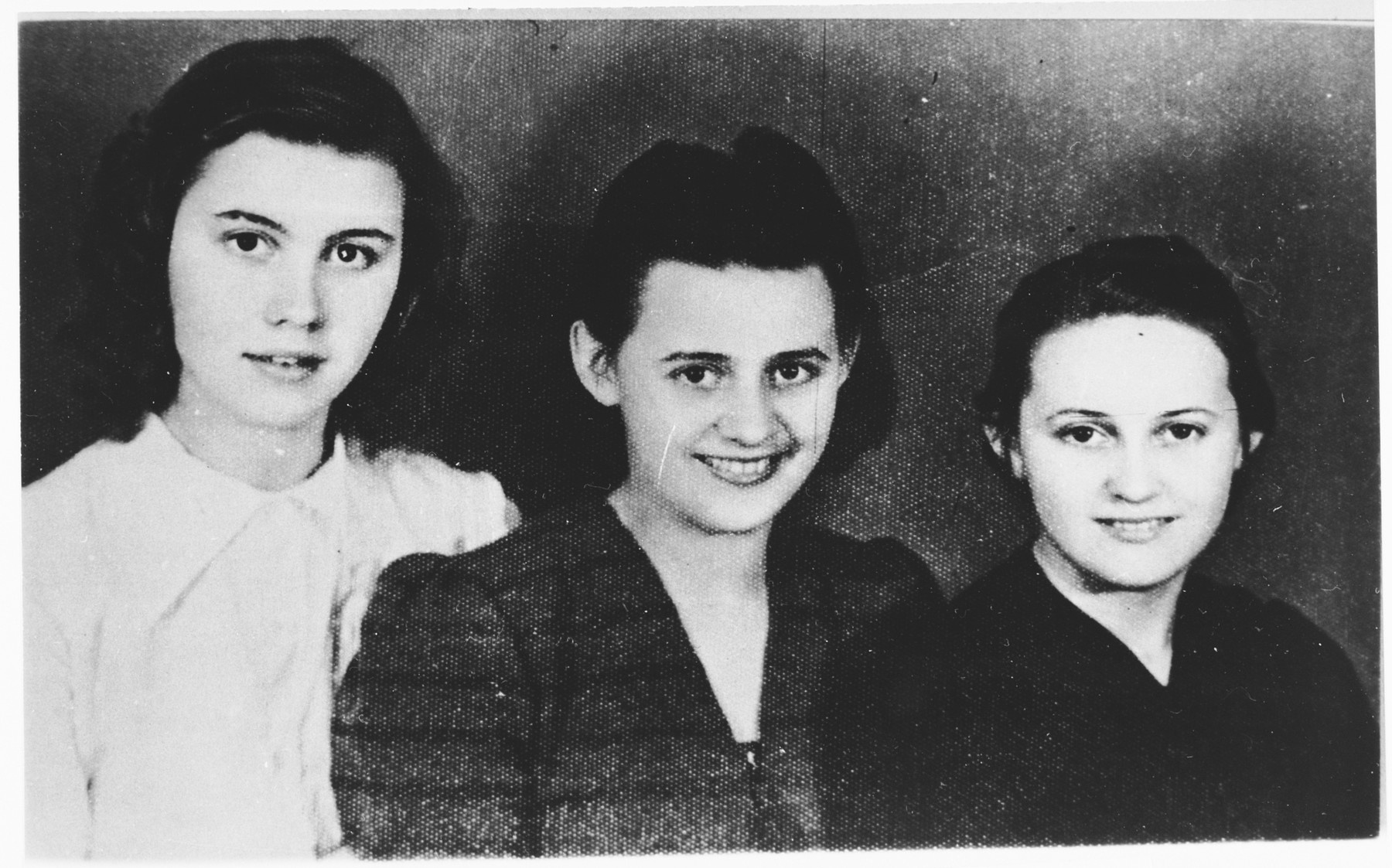 Studio portrait of the Ditrik sisters from Zenica, Bosnia, [possibly members of the Yugoslav resistance] who were deported to Jasenovac on December 16, 1944.  

Pictured from left to right are: Borka (18), Angelina (20), and Miroslava (16).  They were killed in Ustice, where the Una River meets the Sava River.