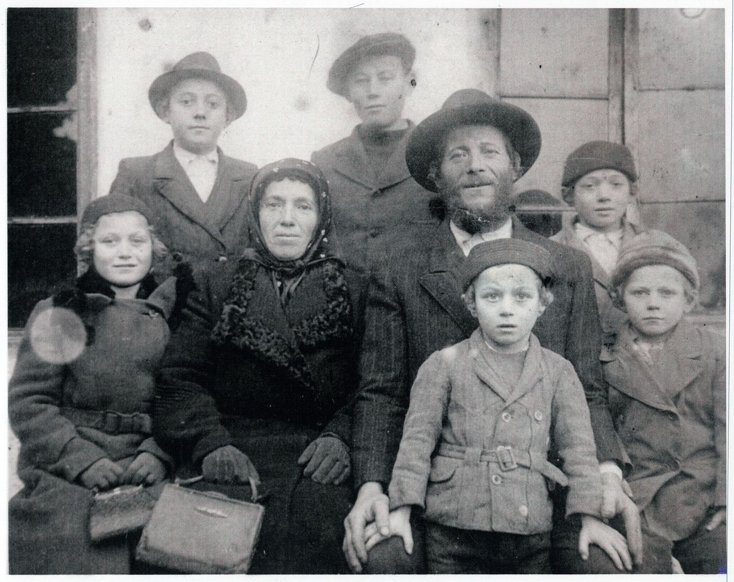 Portrait of a religious Transcarpathian Jewish farmer, his wife and six of his children.

The farmer, Chaim Simcha Mechlowitz, became immortalized as the farmer in Roman Vishniac's collection "A Vanished World."