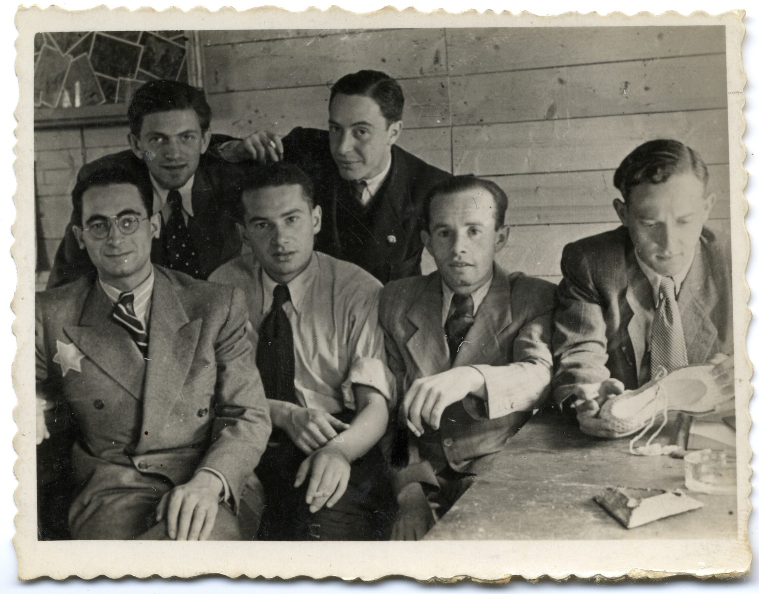 Group portrait of employees of the leather workshop in the Lodz ghetto.

Among those pictured is Leon Fajtlowicz (front, left).  He was the uncle of the donor and in charge of all the leather workshops in the ghetto.