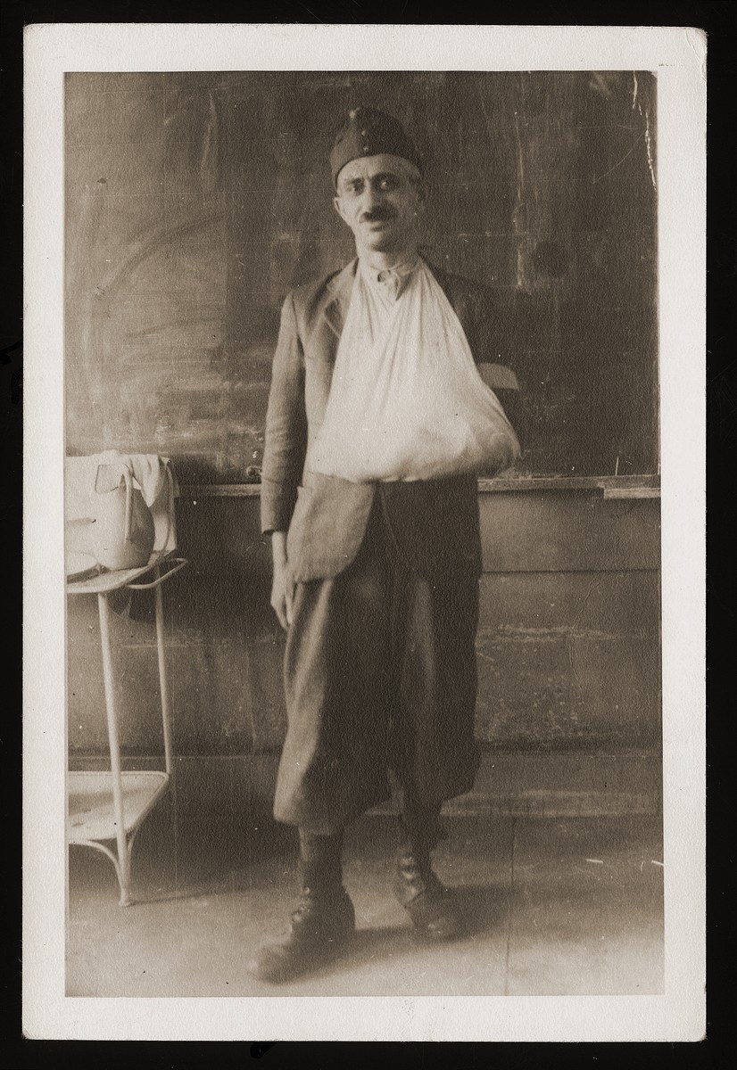 Portrait of Sandor Guttman in the uniform of a Hungarian labor battalion with his arm in a sling.