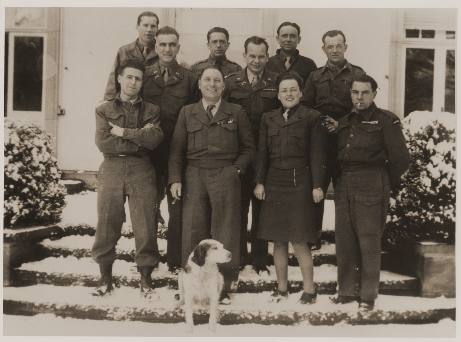 Group portrait of UNNRA officers in Wuerttemberg.  Michel Shadur is pictured in the top row, third from the left.