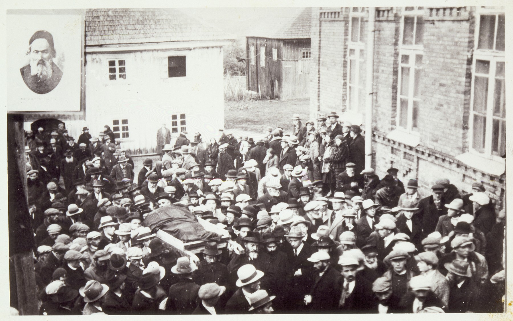 A large crowd of disciples gathers at the Radun Yeshiva to escort the body of the Hafetz Hayyim during his funeral.
