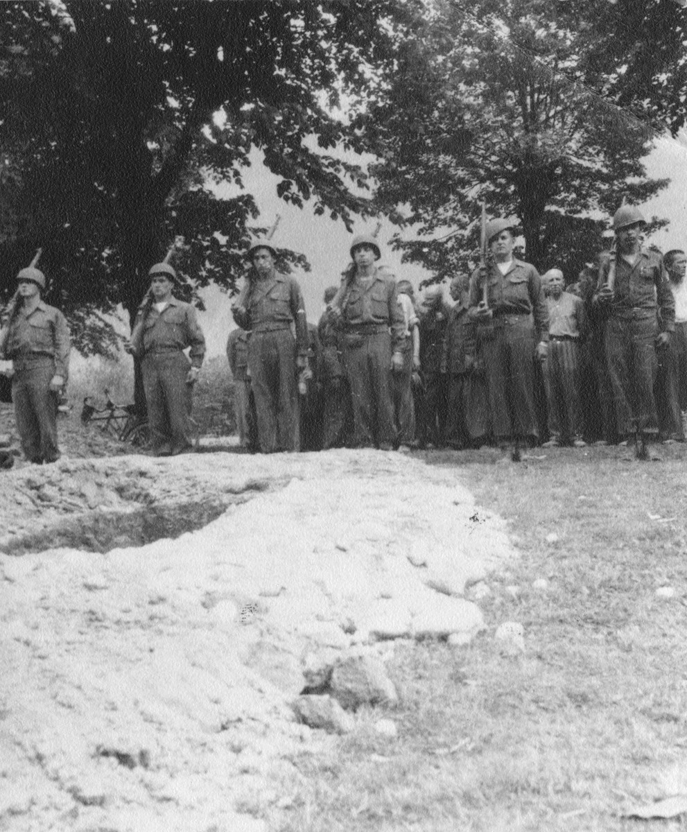 American soldiers provide a military burial for a Soviet colonel who had been imprisoned in Ebensee and died from tuberculosis.

Pictured from left to right are Kansas Fleming, Russell Pett, Ray Santos, Dick Pomante, John Wright and John Doll.