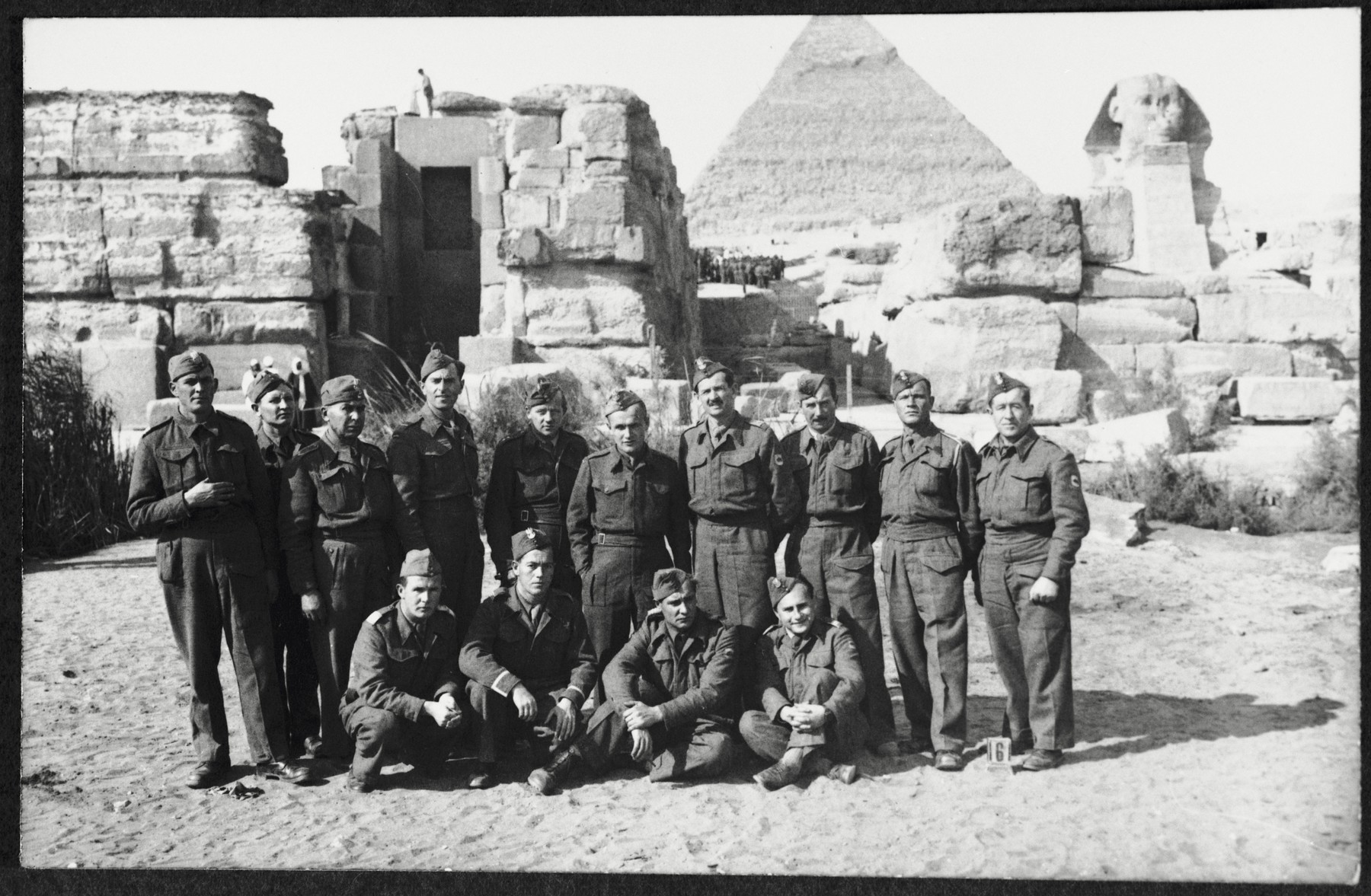 Group portrait of members of the 2nd Polish Corps (Anders Army) during an excursion to the Sphinx in the Giza plateau near Cairo, Egypt, where they were stationed in the winter of 1944.

Among those pictured are Markus Rosenzweig (standing fourth from the left), Jan Wysoki (sitting on the far right), and his friend  Bolek Stankiewicz (standing second from right).