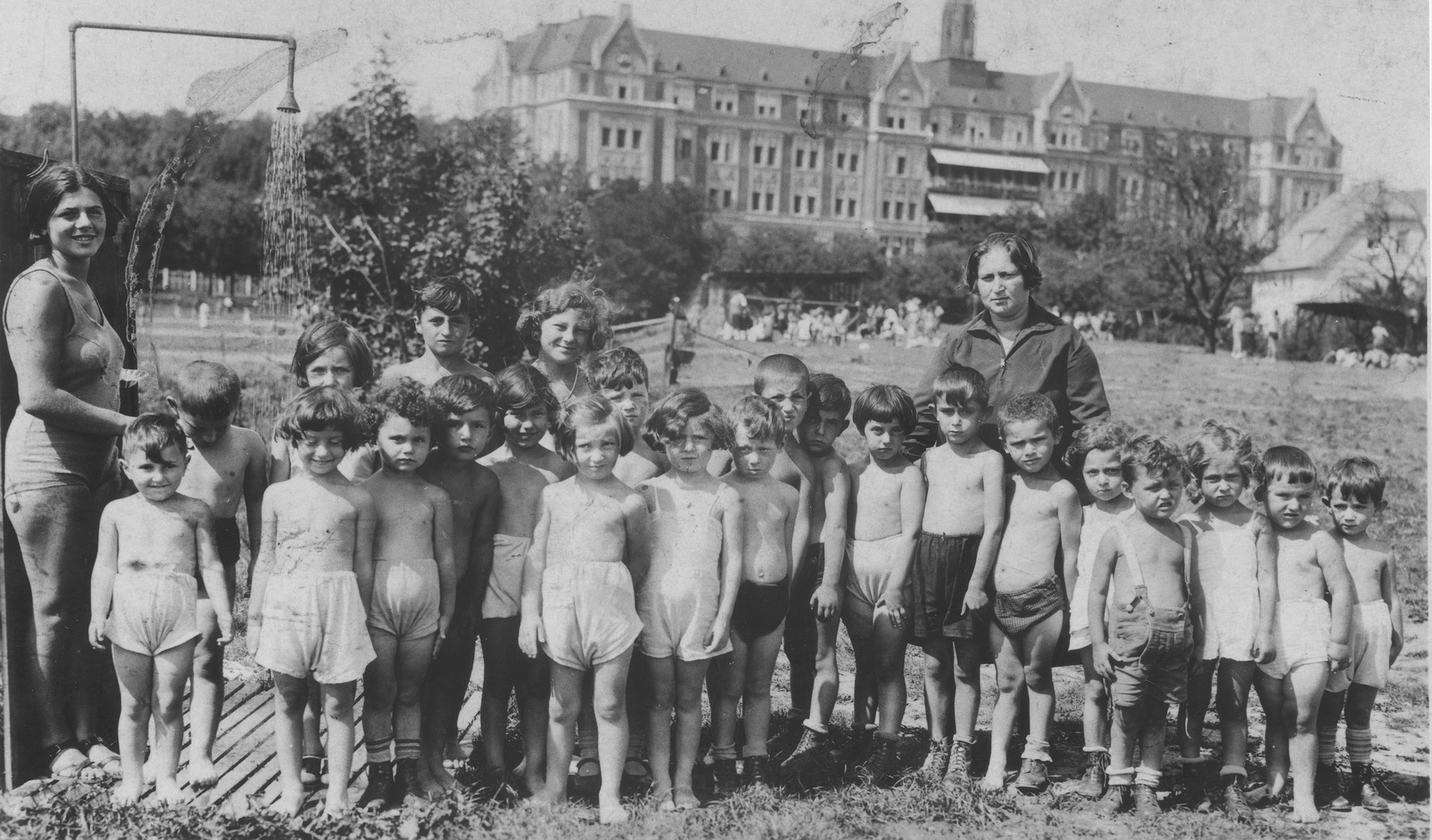 Group portrait of children in a summer camp on the outskirts of Vienna.

Carl Roman is pictured in the first row, center, eighth from the left.