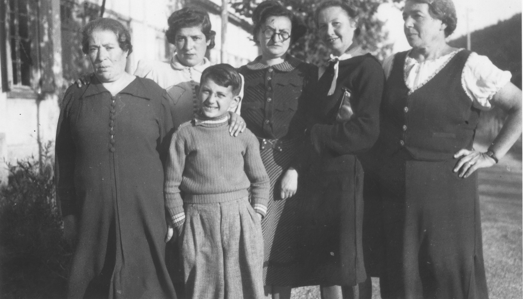 Marianne (Uhrmacher) Roman poses with a group of female prisoners in an unidentified French internment camp.