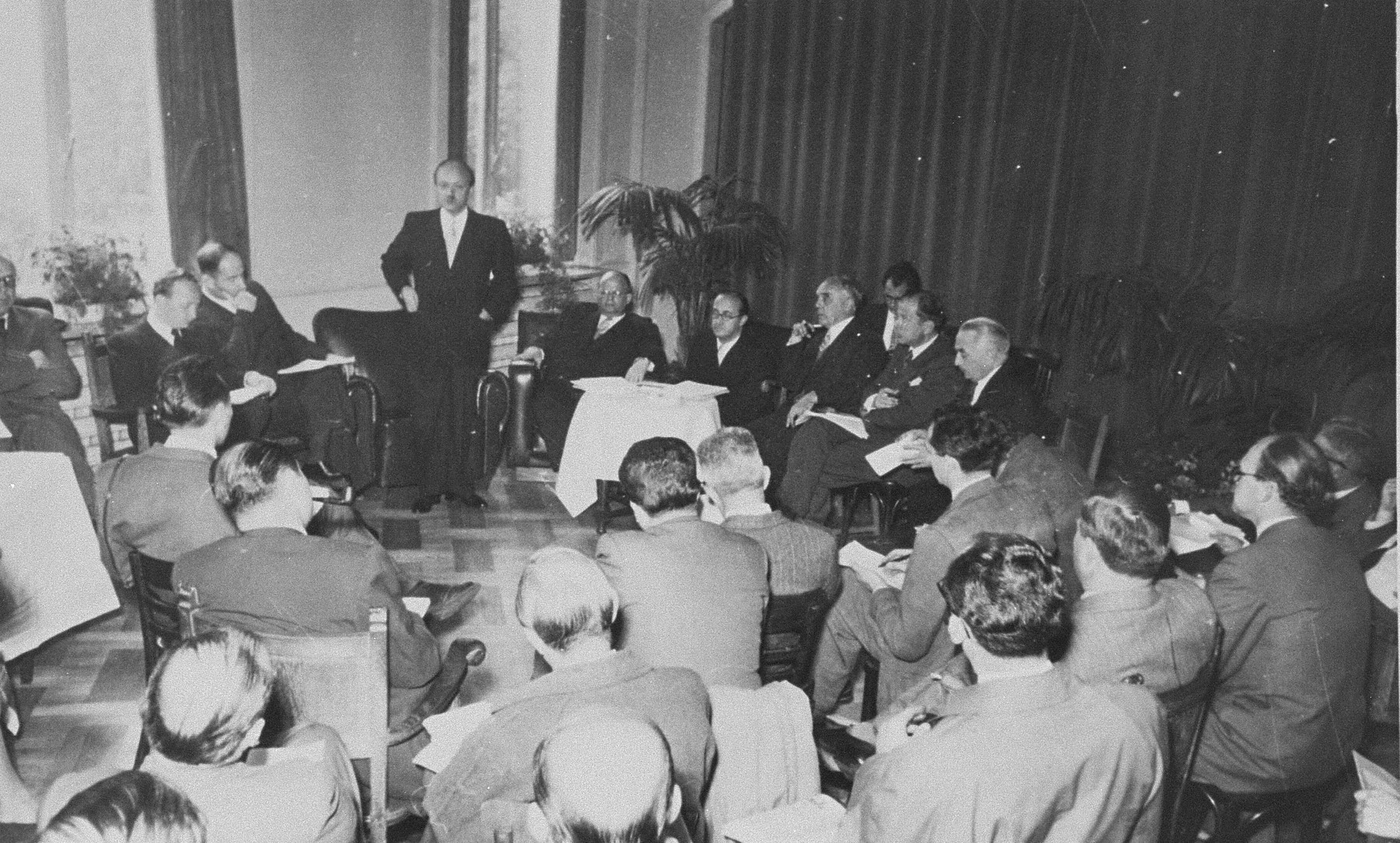 A briefing by members of the Conference on Jewish Material Claims in Luxembourg during the signing of the Reparations Agreement between the German Federal Republic, the State of Israel, and the Conference on Jewish Material Claims.  

Among those pictured is Benjamin Ferencz (second from the left).