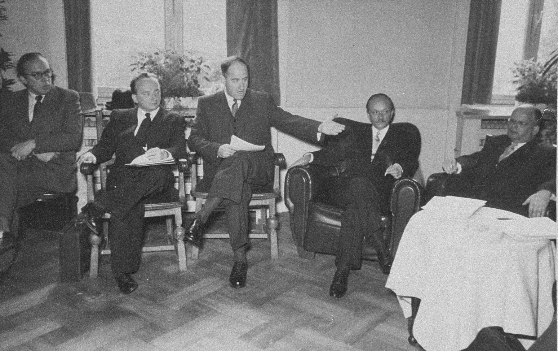 Members of the Conference on Jewish Material Claims meet in Luxembourg for the signing of the Reparations Agreement between the German Federal Republic, the State of Israel, and the Conference on Jewish Material Claims.  

Among those pictured is Benjamin Ferencz (second from the left).