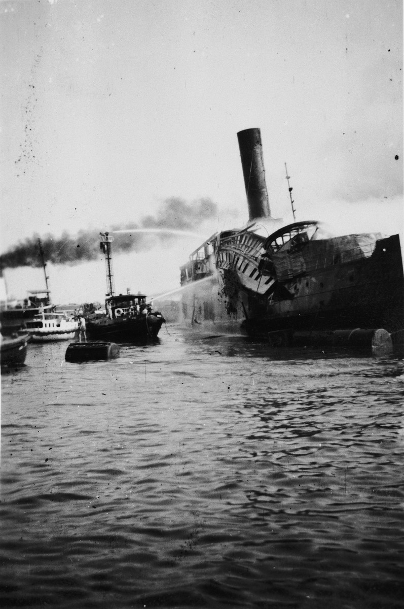 Fireboats try to put out a fire on the Exodus 1947 ship in Haifa harbor.