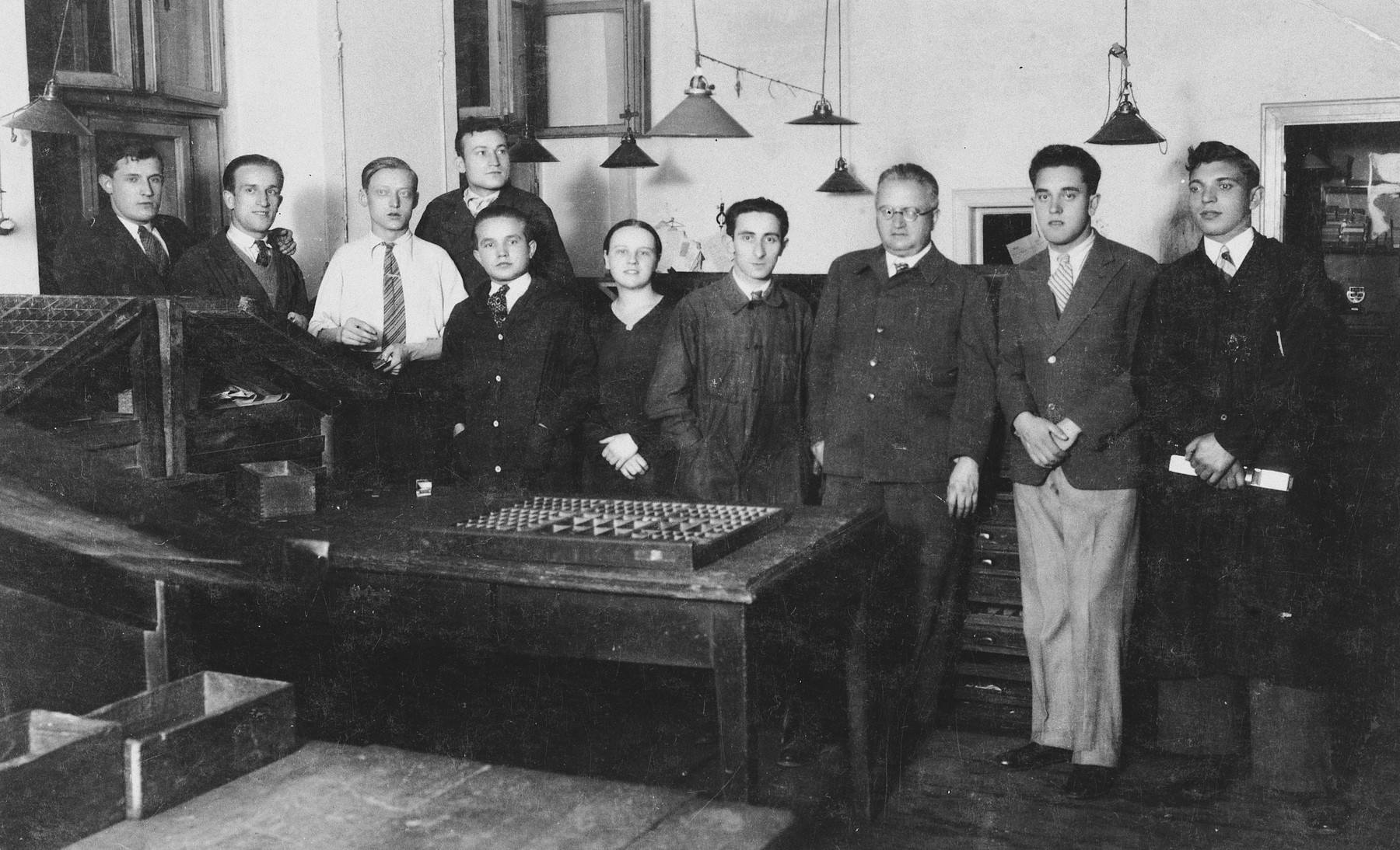 Polish and Jewish workers in a printing press in Kalisz.

Among those pictured is Heniek Storch (fourth from the right) who was head of his section.