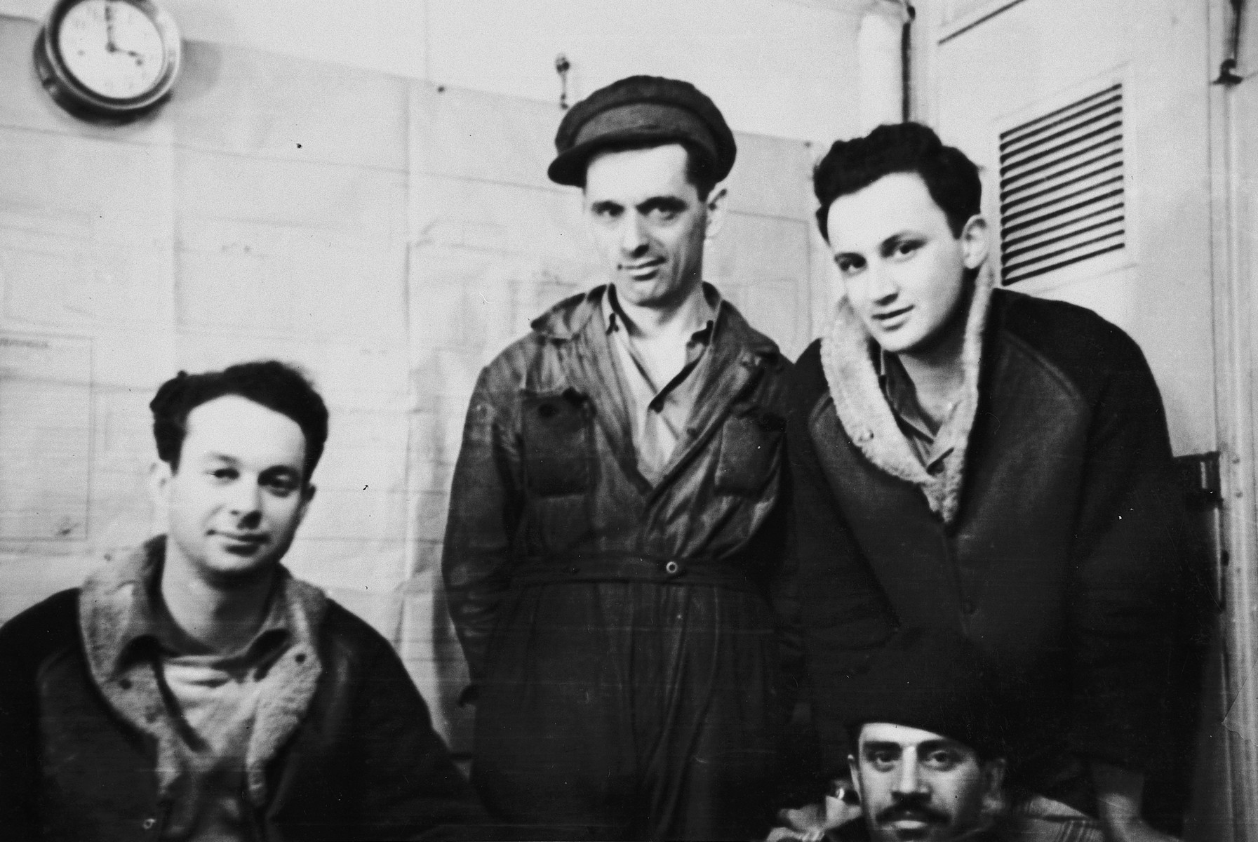 Four crew members of the Pan Cresent (Atzmaut) pose in a room below deck.

Pictured from left to right are Chaim Goldis, a Romanian engineer Katz and Gad Lifshitz.  Pictured in front is Berchik Lifshitz (Dov Magan).  Goldis and Gad Lifshitz were radio operators and Dov Magan was the ship's commander.  They also belonged to the Palyam, the naval branch of the Palmach.  Goldis was a platoon leader and killed near Hulda at the end of March, 1948.