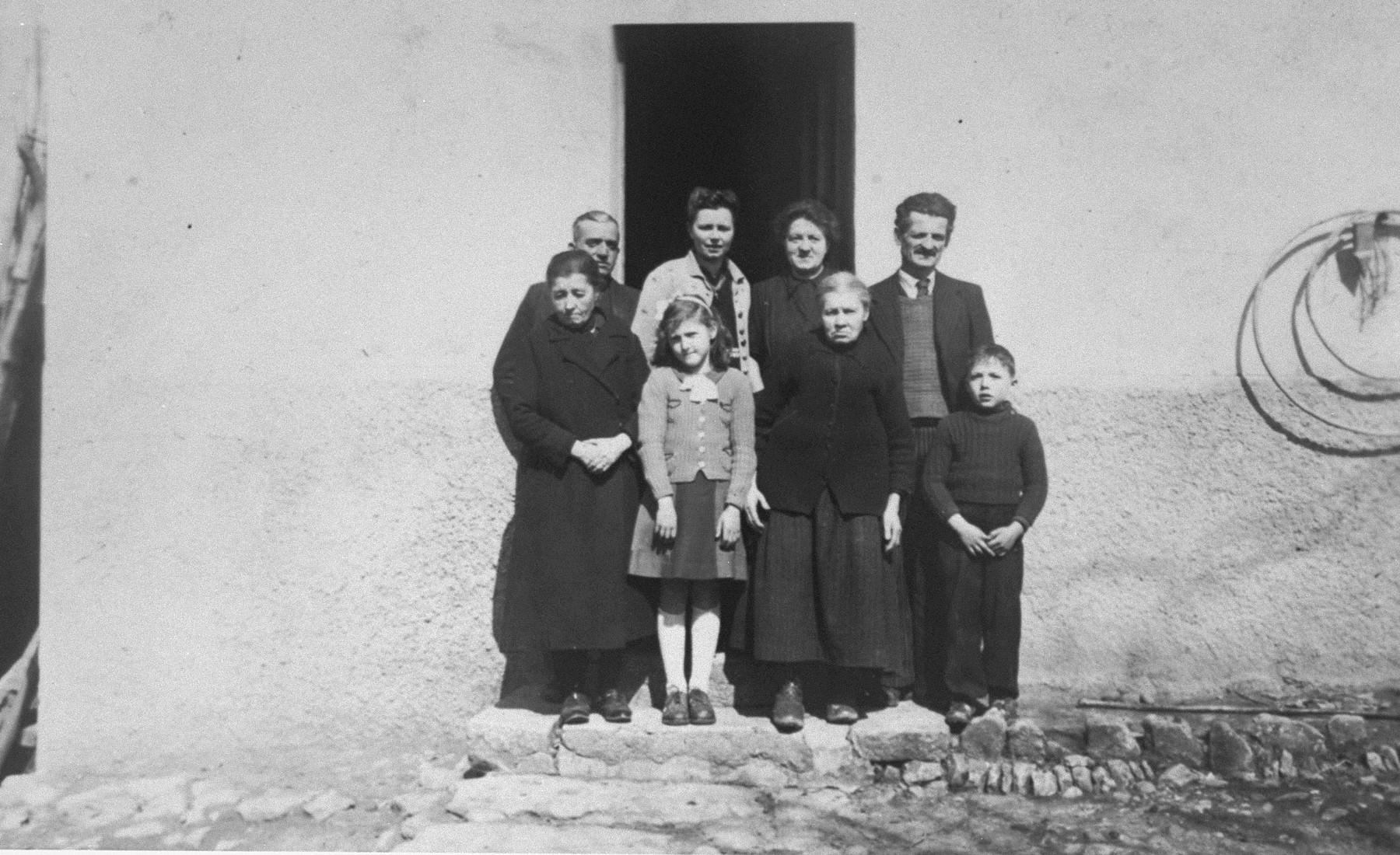 Berthe Lewkowitz (front, second from left), and her brother, Jacques (front right), with their rescuers, Victor and Josephine Guicherd (back right).