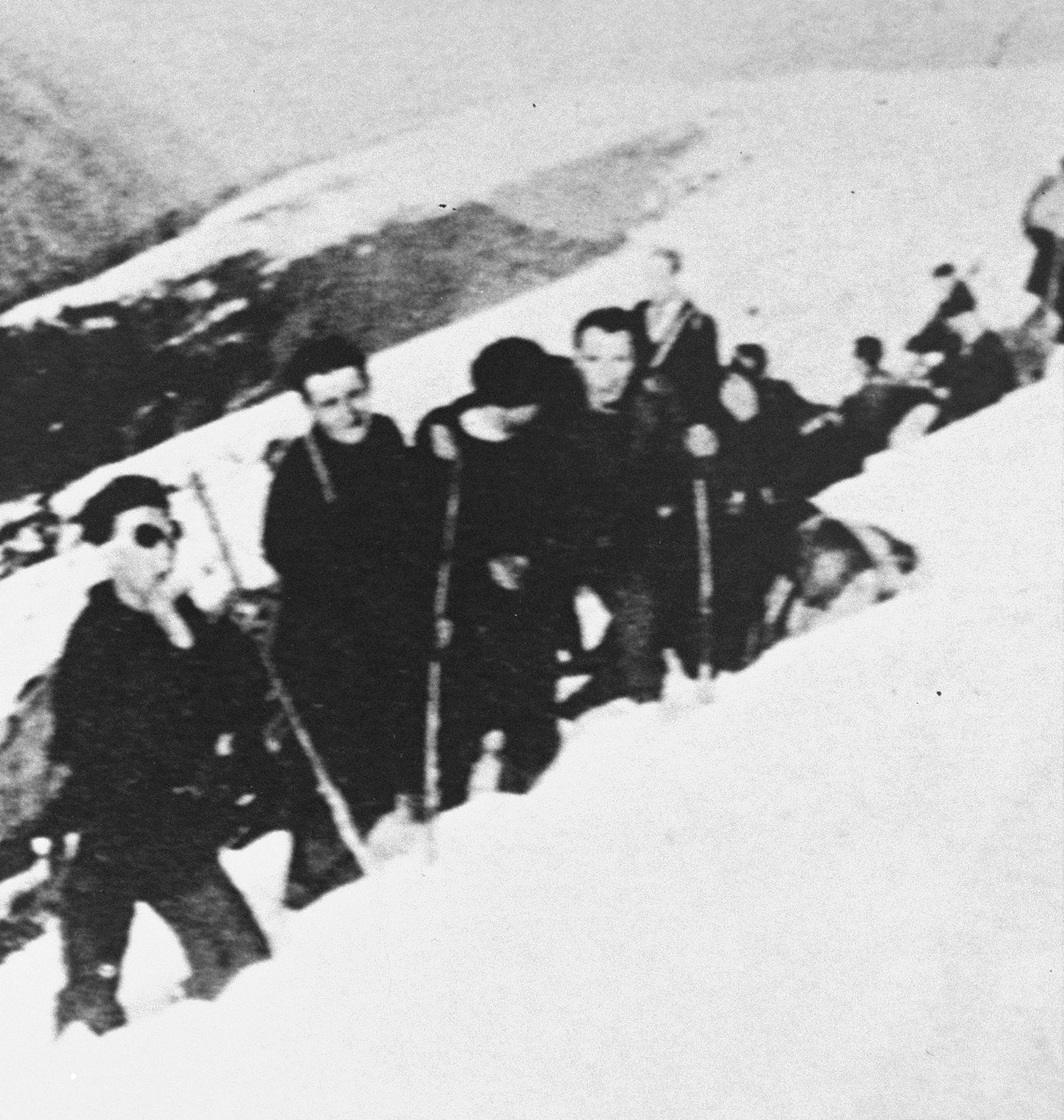 A group being smuggled out of France plows through snowdrifts on a rugged mountain pass in the Pyrenees.  The group was rescuted with the help of John Weidner's Dutch-Paris network.