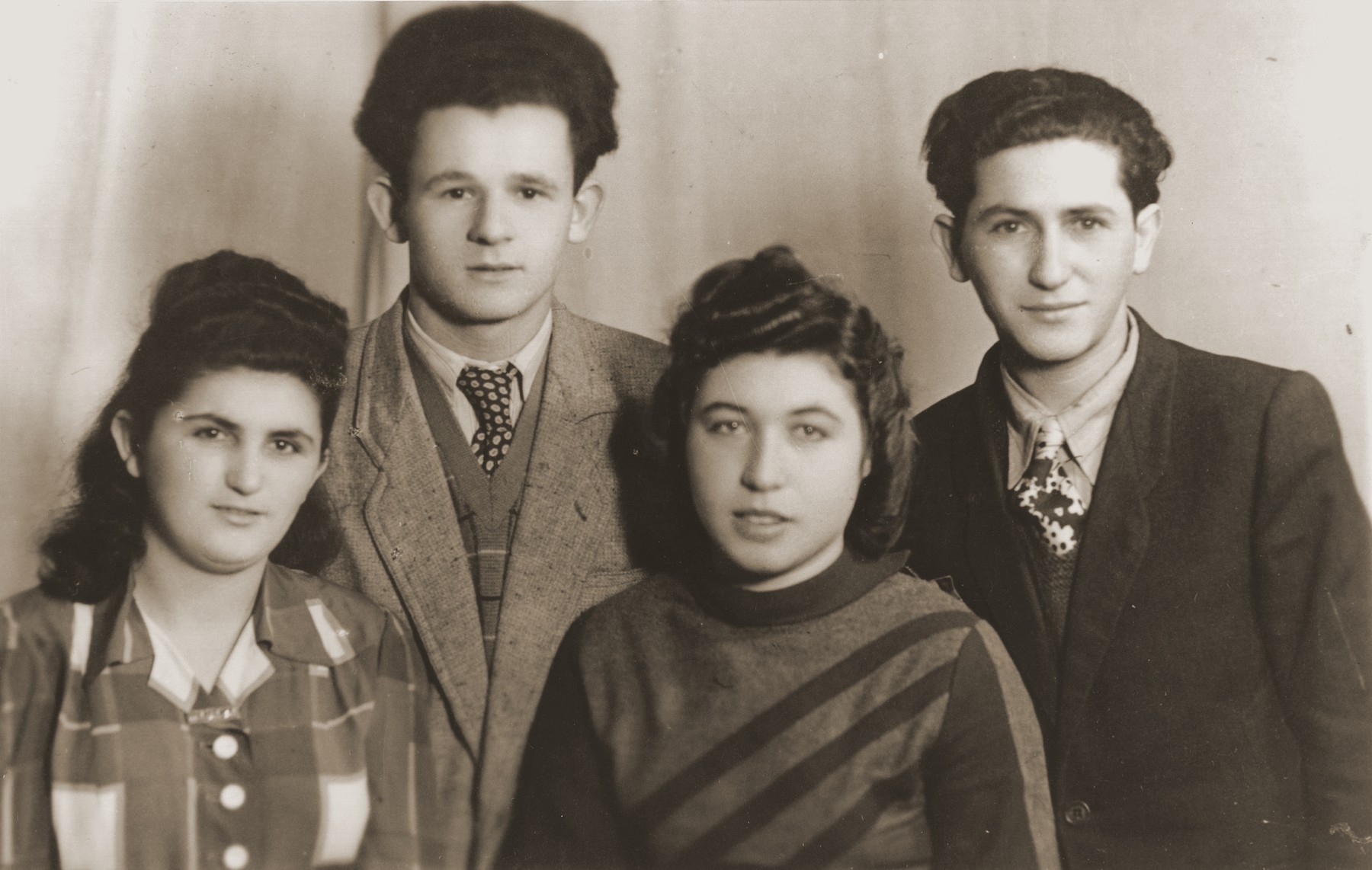 Group portrait of four young people in the Bad Reichenhall displaced persons camp.

Rochelle Szklarski is pictured second from right.