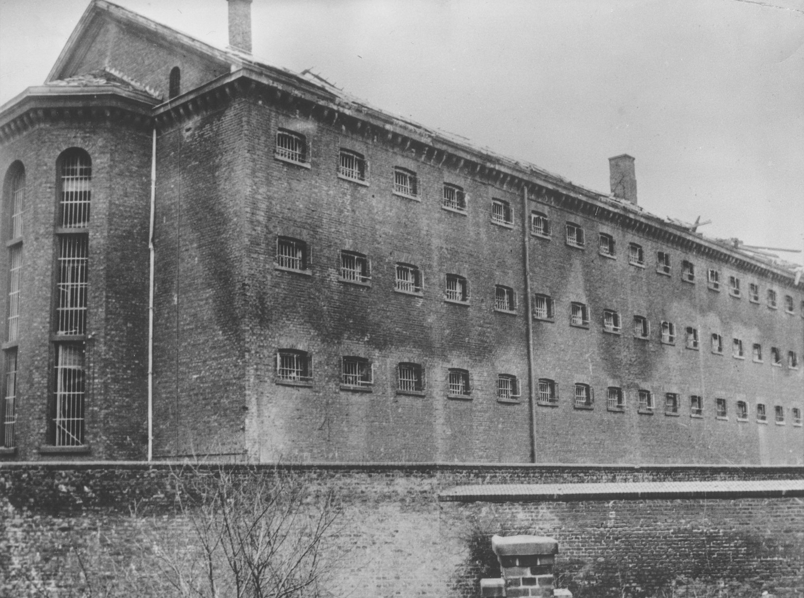 View of one wing of a Gestapo prison in Koeln.

It was the only wing of the prison that escaped bombing by Allied warplanes.  The entire building contained nearly a quarter-mile of cells.  Most of the inmates were charged with being members of the underground and with aiding or hiding Russians and Poles.  Upon the prison's capture by First U.S. Army troops on 6 March 1945, 80 prisoners remained.