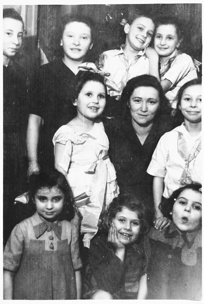 Jewish children and staff at an orphanage in Lodz run by the Koordynacja (Coordination Committee). 

All of the children at the home had been hidden by Christian families during the war.  Pictured are Ania, Rela, Nina, Danuzia, Basia, Dienja, Wandercerka, Halinka, Juka, and Renia.