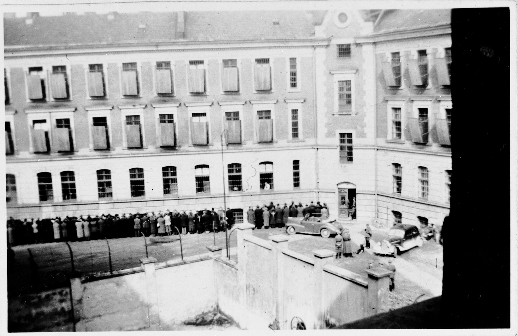 Civilians arrested by German police are held prisoner in the courtyard of the Montelupich prison in Krakow.