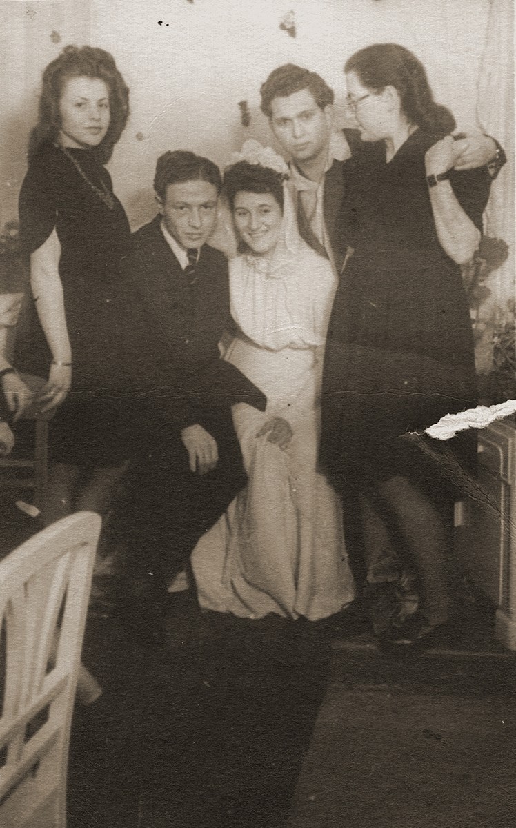 Wedding of Hinda Chilewicz and Welek Luksenburg in the Weiden displaced persons' camp. 

Standing behind them are Halinika Szegotzky and Kalman and Ada Blacharz.