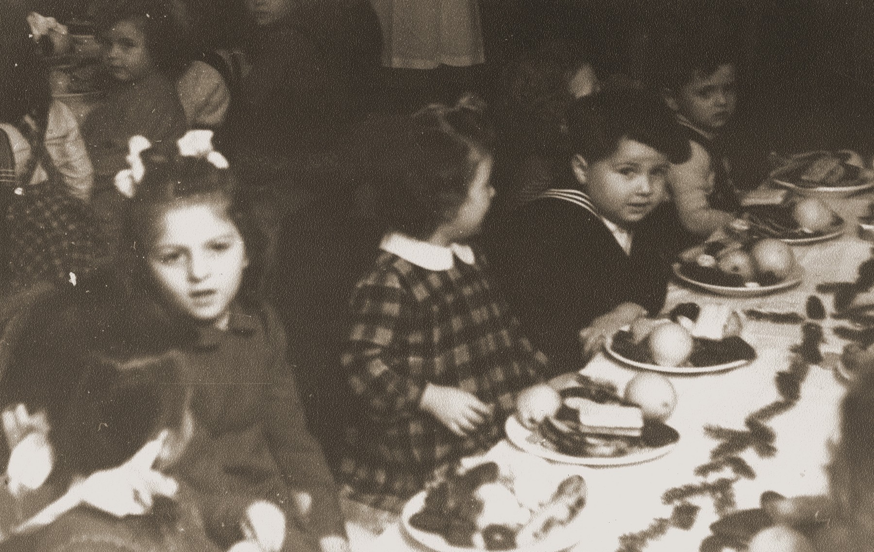 Pre-school children who were born in  the Bergen-Belsen displaced persons' camp, attend a birthday party at the camp.