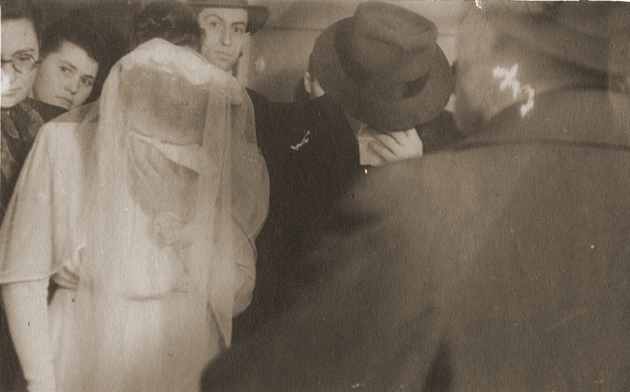 Wedding of Hinda Chilewicz and Welek Luksenburg in the Weiden displaced persons' camp.  The bride and groom weep during the recitation of a prayer in memory of their parents.