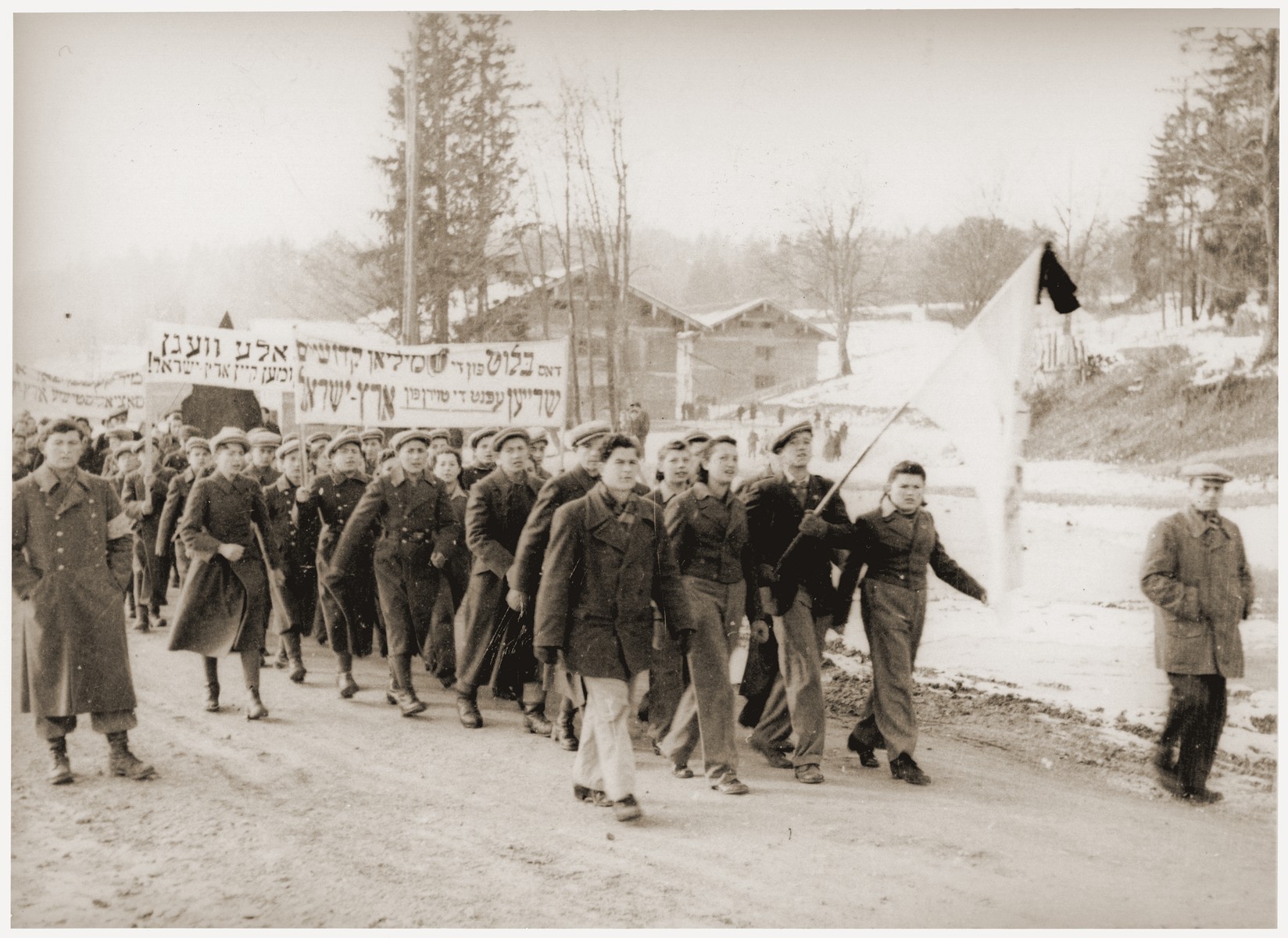 Jewish DPs at the Feldafing displaced persons camp march in protest against the refusal of the British government to open the gates of Palestine to Jewish immigration.