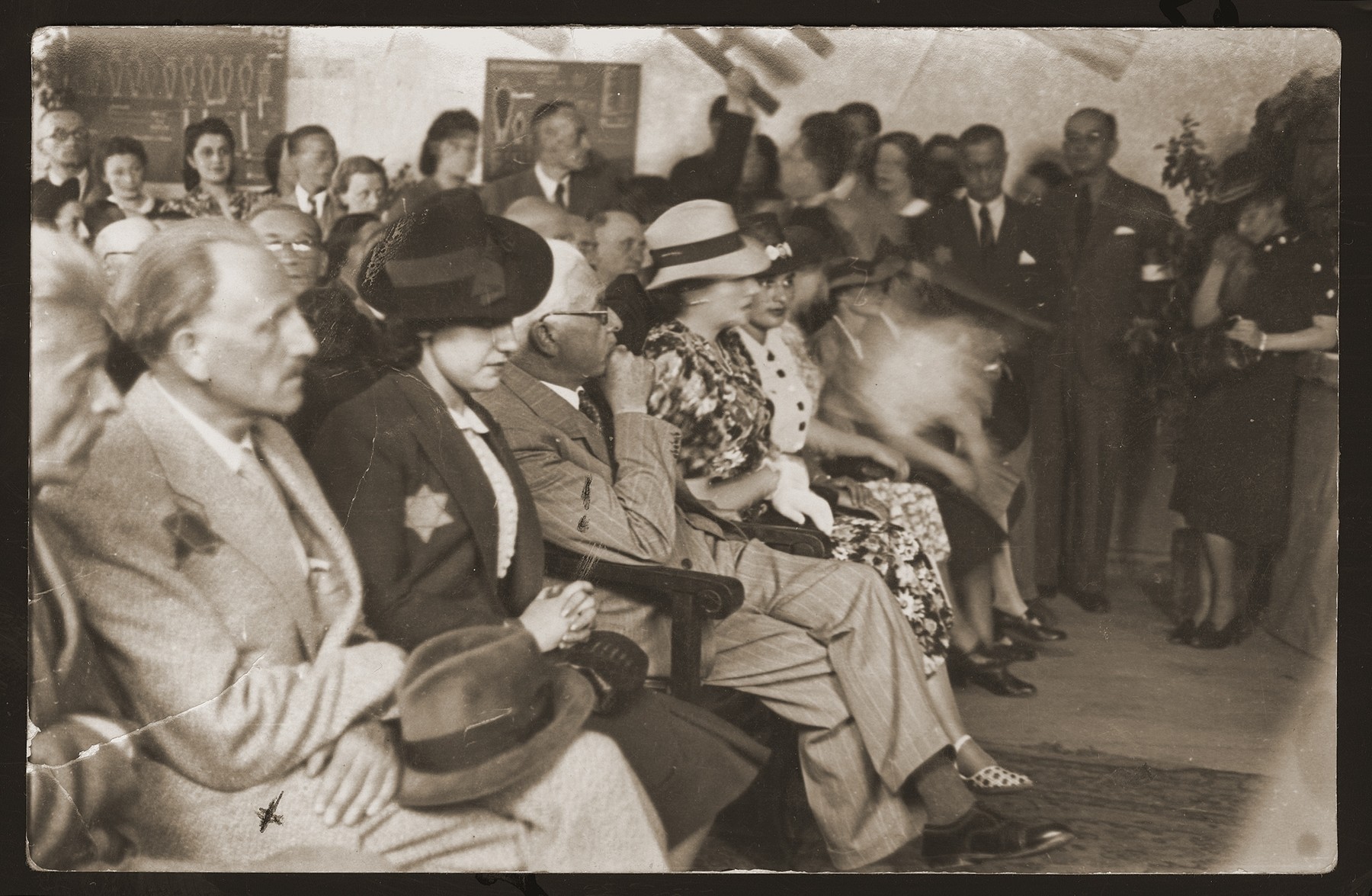 Jewish council chairman Mordechai Chaim Rumkowski (fourth from the left), attends a ceremony in the Lodz ghetto.  

Also pictured are Dora Fuks (third from the left) and Dr. Michal Eliasberg (second from the left).