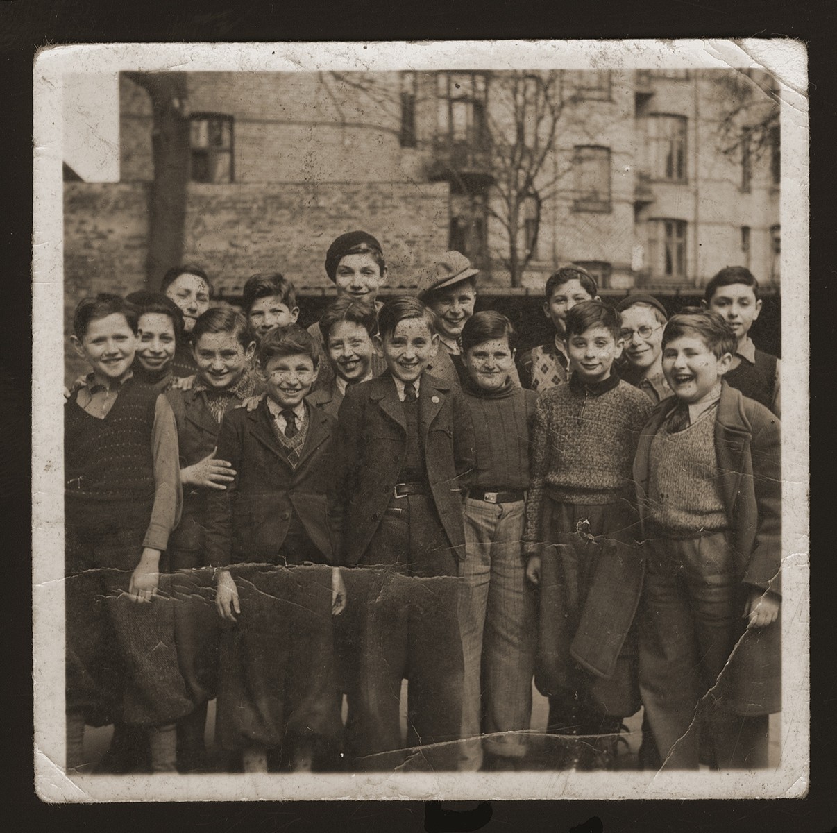 Boys from the Mosaisk Drengeskole (Mosaic Boys School).  

Among those pictured are Artur Arnheim (front row, left), Raphael Sampolinsky (second from left), Bent Melchior, grandson of chief rabbi (fifth from left), Manfred Hildershein (back row center), Siegried Vogel (third from right).
 
The Mosaic School for Boys and the Caroline School for Girls were established in the beginning of the nineteenth century for the purpose of acculturating the children of Russian Jewish immigrants into Danish culture.  Though most of the teachers were not Jewish, the school also taught Jewish history and religion.