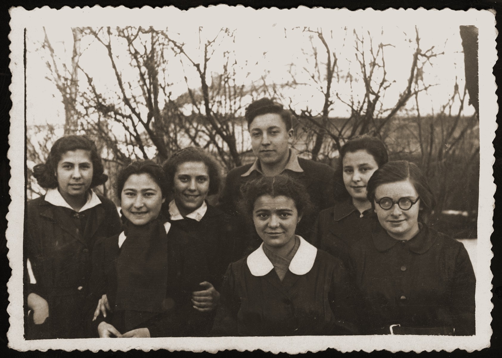 Group portrait of members of an Hashomer Hatzair Zionist youth group in Bialystok.  

Among those pictured are Malka Orkin (center, front) and her friend Tusia Goldberg (third from the left).  Tusia, whose father later became a member of the Bialystok ghetto Jewish council, survived the war.