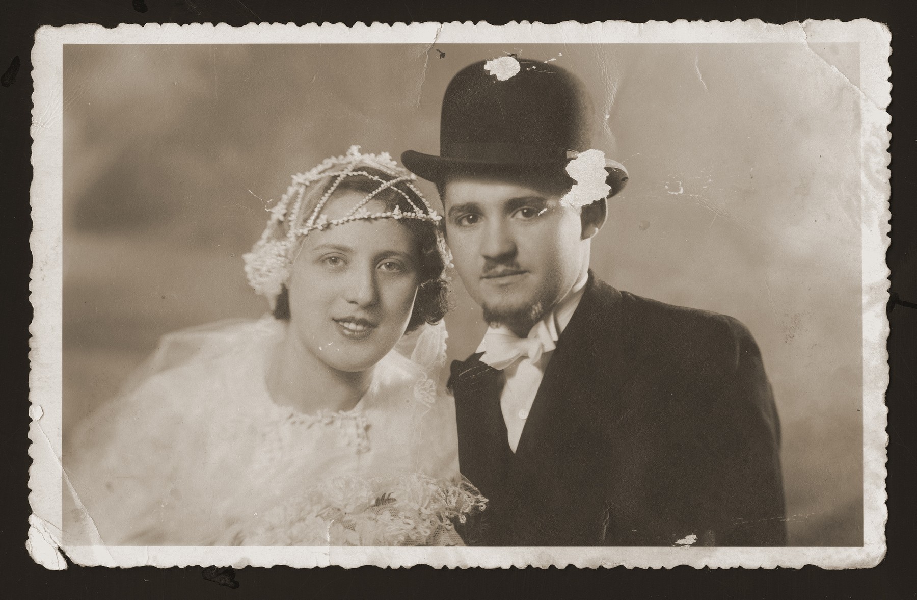 Wedding portrait of Gabor and Tubi (Goldstein) Berkovic.   He served as a cantor, originally as his brother-in-law's assistant.  Their two sons, Emil and Eddie, both became cantors as well. The family survived the Holocaust hiding in a farm near Senica.