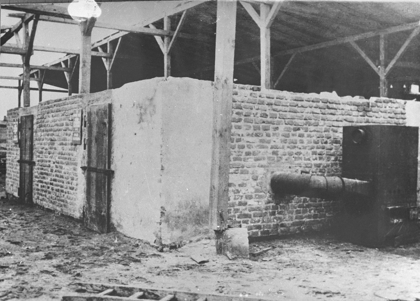 The rear side of a gas chamber.  The furnace to the right was used to create carbon monoxide for gassing prisoners. (Post-Liberation).