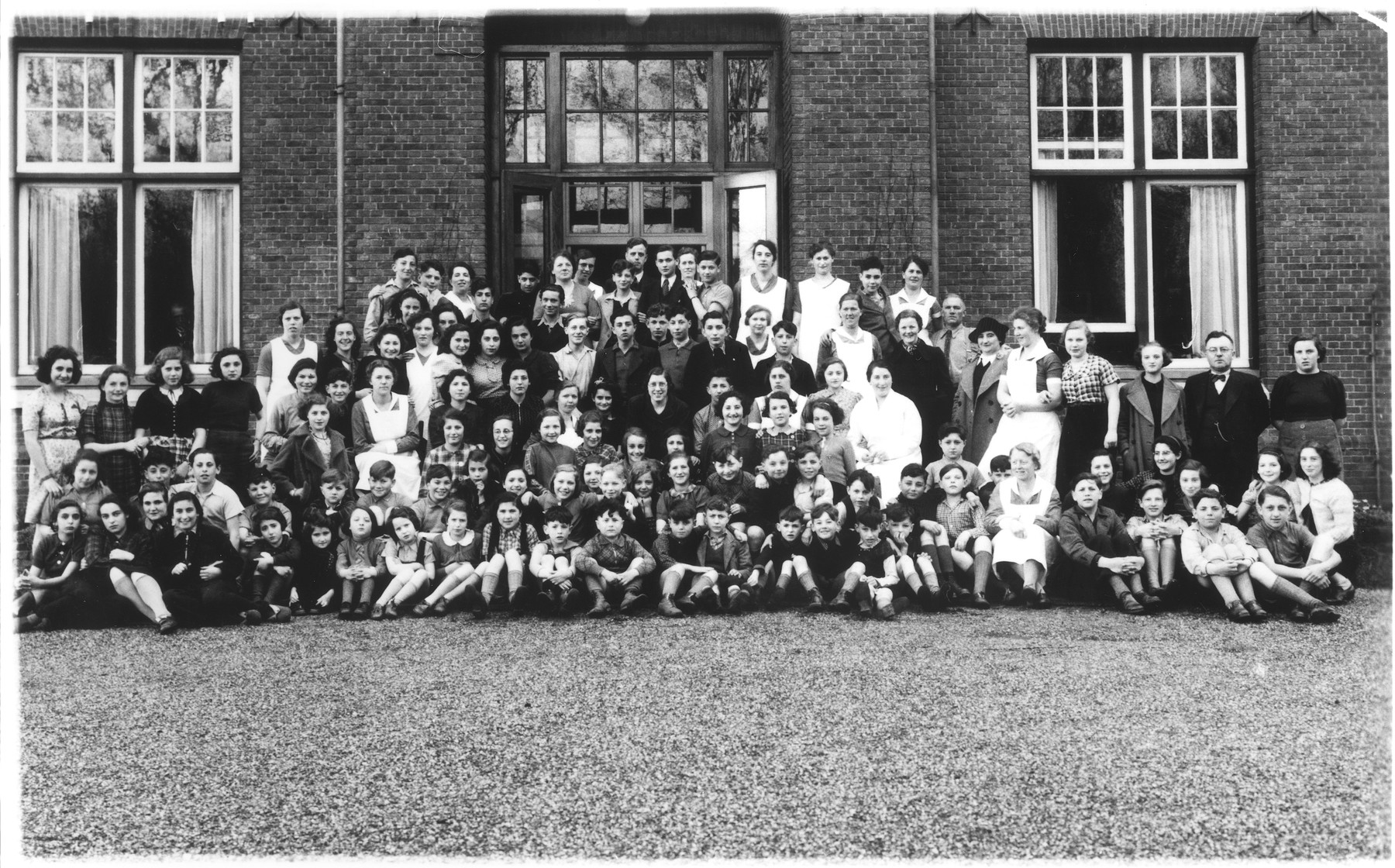 Group portrait of German Jewish refugee children who had come to the Netherlands on a Kindertransport, shortly before their evacuation to Britain.

Those pictured include Hans and Oskar Levy, Helga and Kurt Gottschalk, Mirjam [and probably Otto and Edith] Szpiro.