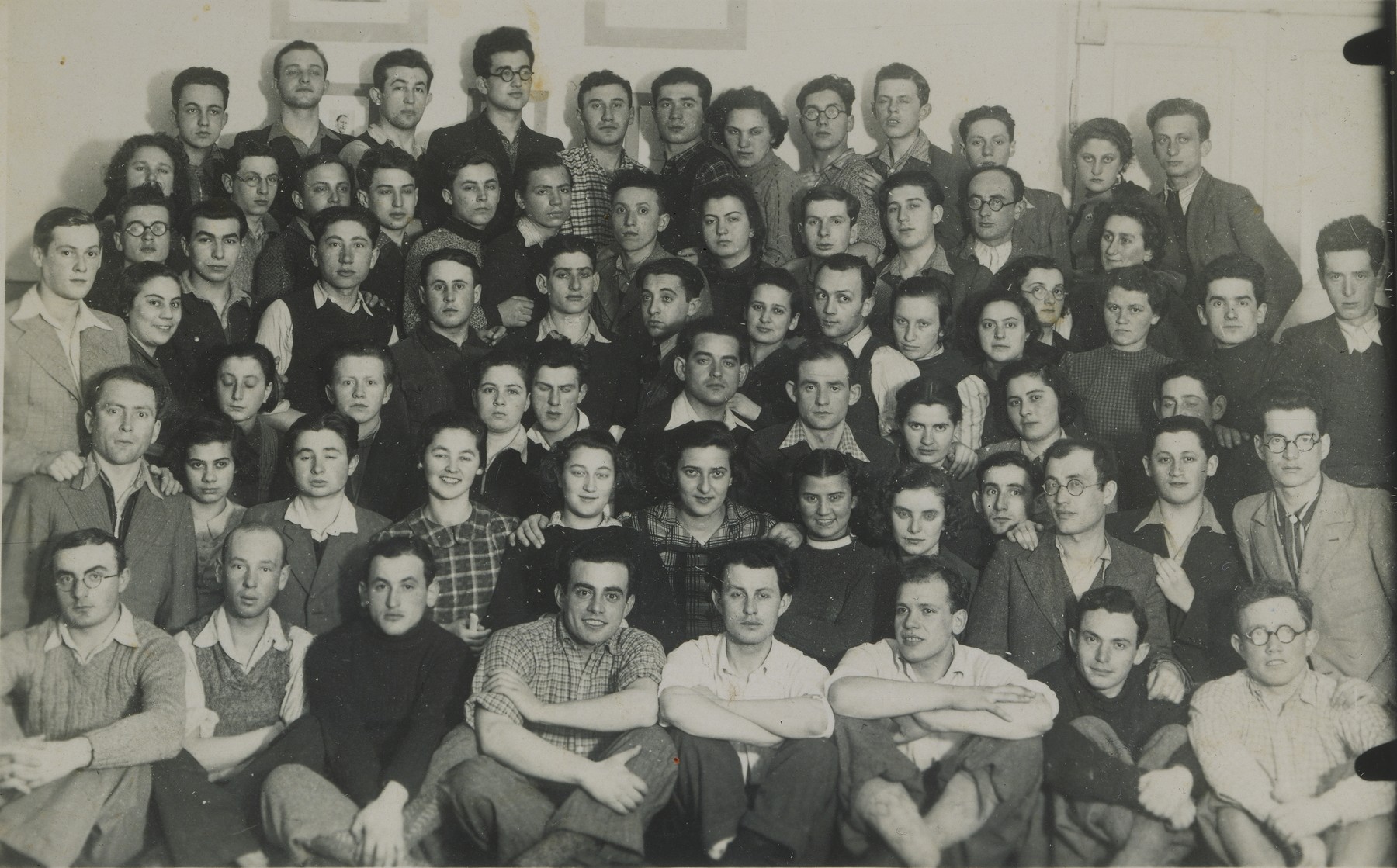 Group portrait of members of an Akiva Zionist youth hachshara [agricultural collective] that had moved to Vilna after the German occupation of Poland.

Among those pictured are Dov Kipnis, David Berger, Tova Maunter, Aaron Kaufman, and Huma Dank.  All but ten perished during the war.  Of those who survived, only four reached Palestine.