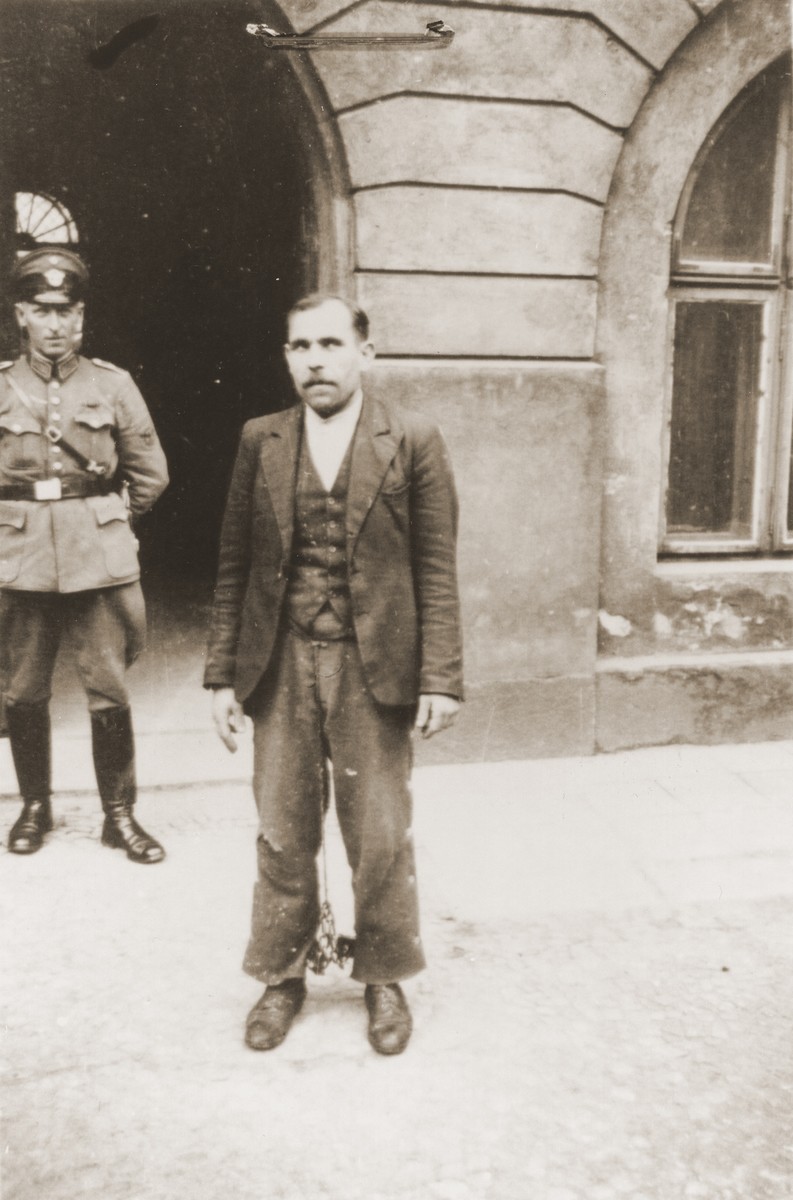 The Polish prisoner Siegmunt Swider (b. May 6, 1906) poses in the courtyard of the county courthouse in Rzeszow.  The special [SS] court sentenced him to death on April 23 and executed him on August 20, 1940.