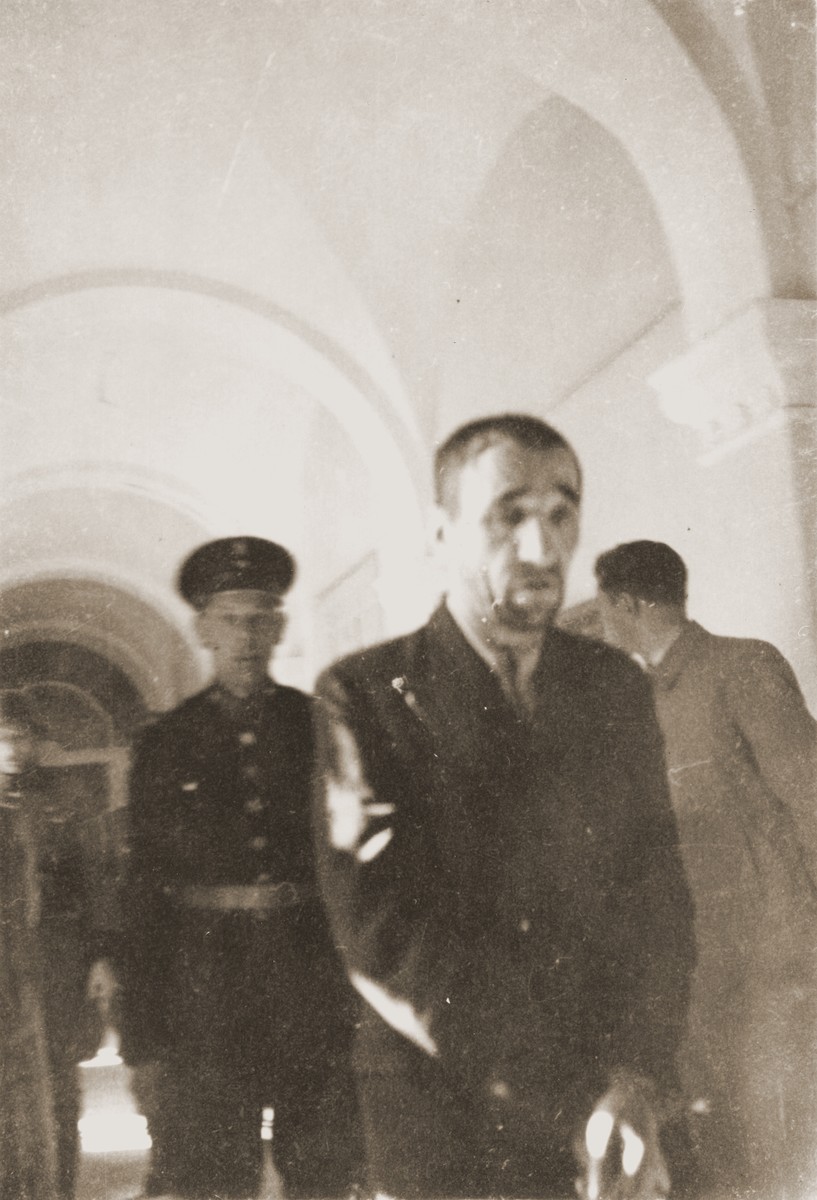 The Polish prisoner Karl Daniskewski (b. September 13, 1893) is led down the hall of the county courthouse in Rzeszow.  The special [SS] court sentenced him to death on April 23 and executed him on May 30.