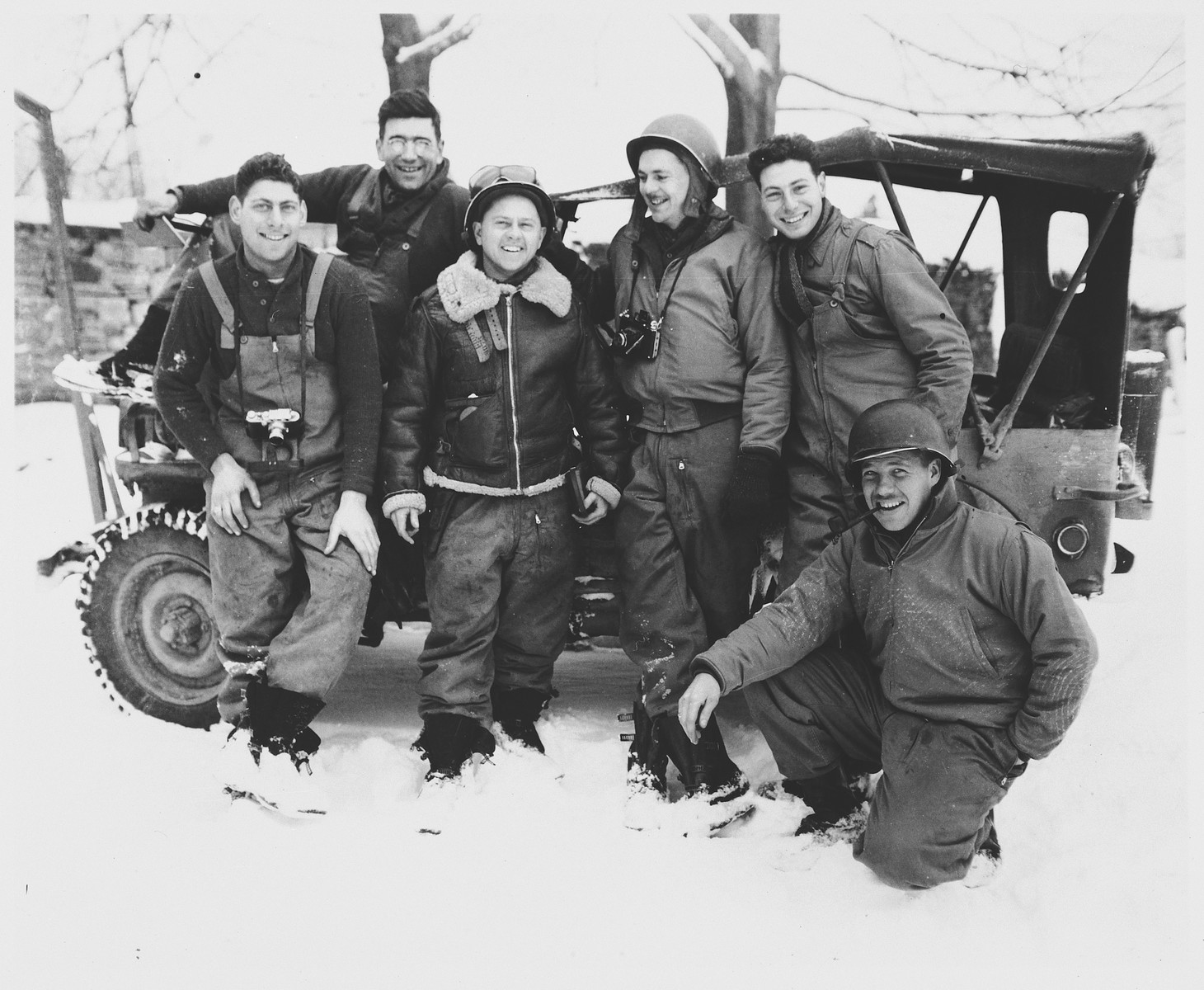 Actor Mickey Rooney poses with the U.S. combat photographers from the 167th Signal Photo Company during his visit to the ETO (European Theatre of Operations).

Pictured from left to right are: Charles Tesser, Carmen Currad, Mickey Rooney, Arnold Samuelson, Eliot Finkels and John C. Perry (kneeling).