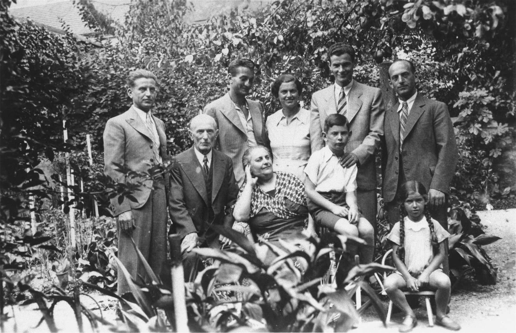Members of the extended Klein family pose outside their home in Zagreb, Croatia.

Among those pictured are Marta and Aurel Kupfermann (the two children) and Julius and Rosa Klein (front row, left side).