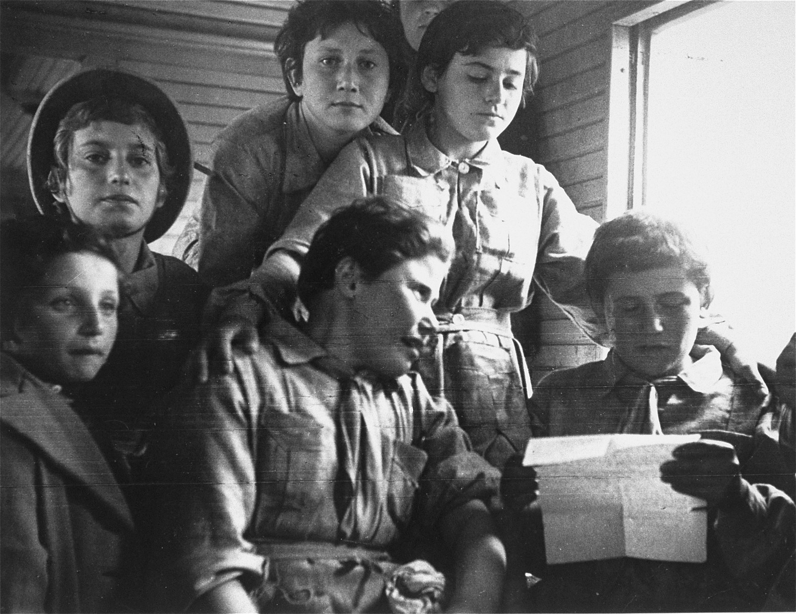 A group of Jewish refugees on the Teheran children's transport travel by train to Palestine.