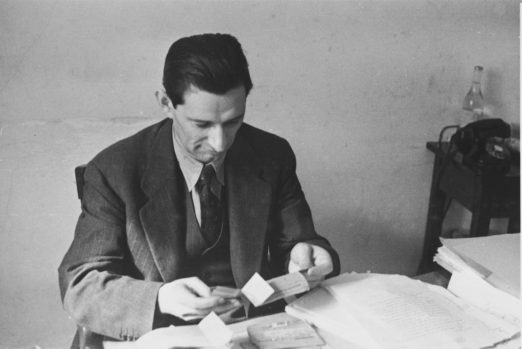 Joseph Schwartz, European director of the American Joint Distribution committee, at work in his office in Lisbon.