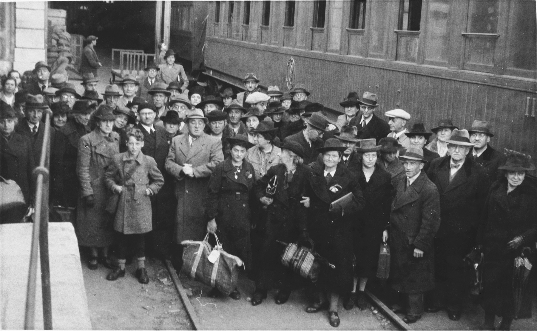 Group portrait of newly arrived Jewish refugees at the St. Appolonia train station in Lisbon.