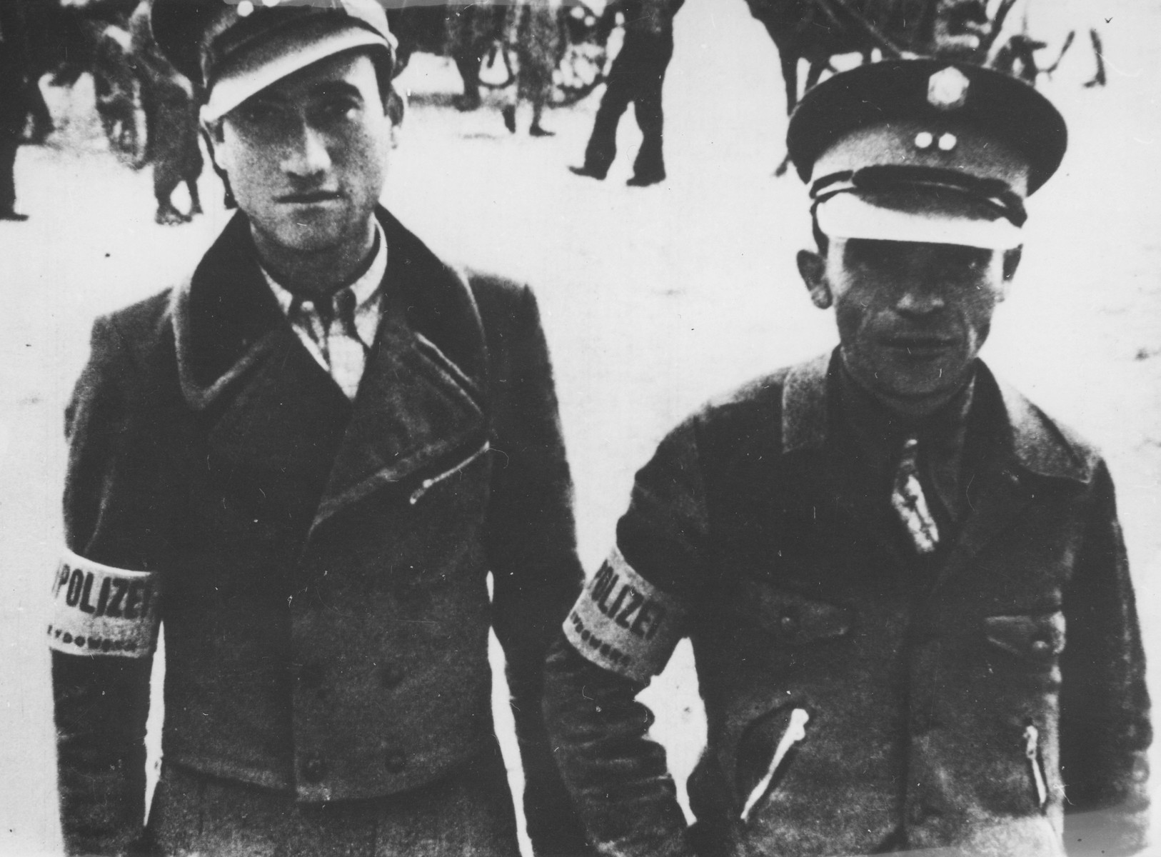 Portrait of two Jewish policemen, presumably in the Wegrow ghetto.
