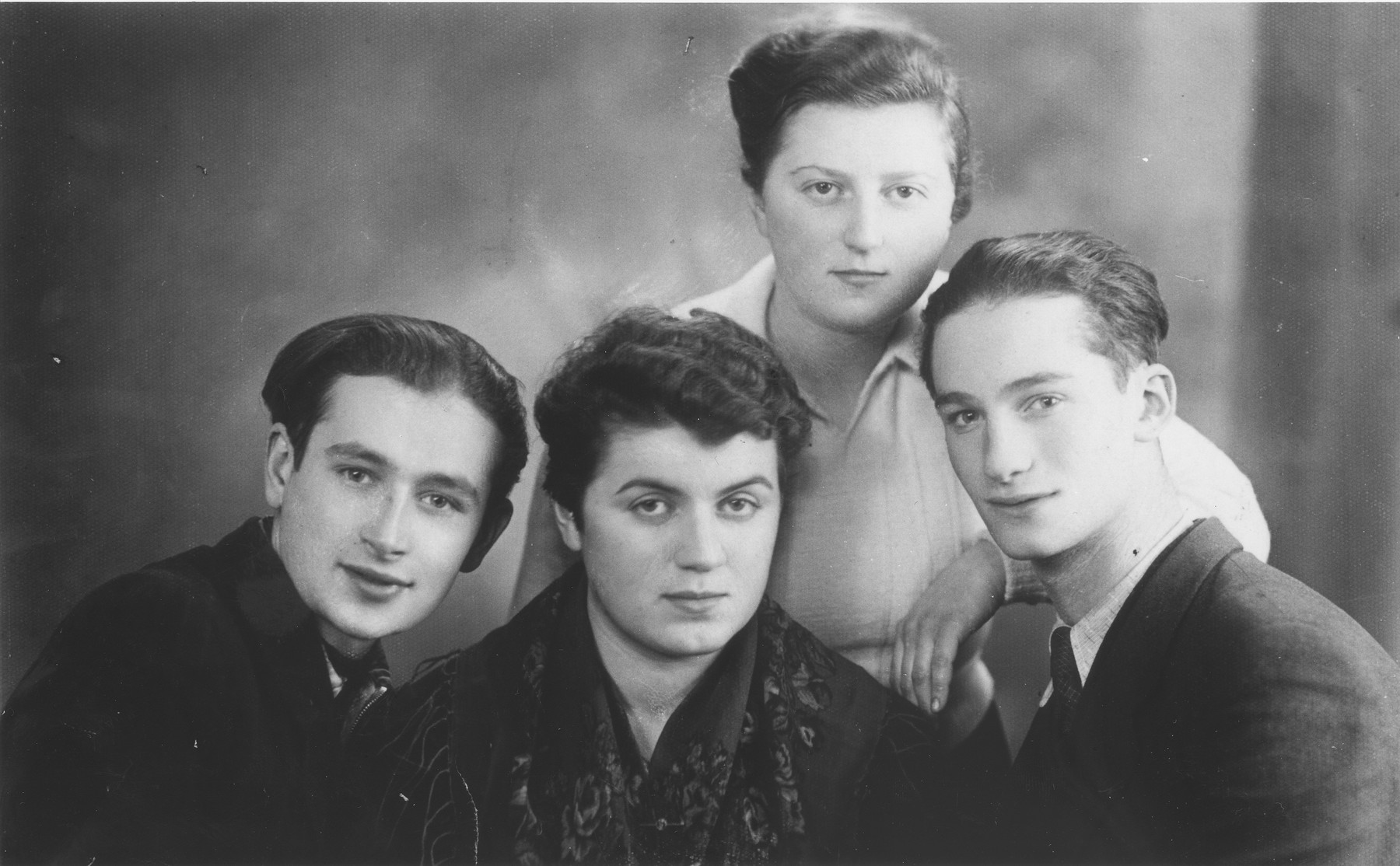 Renia Zylberszac poses with friends in the Dabrowa ghetto.  

Pictured clockwise from the top are: Renia Zylberszac, Otto Szwerd, Mania Gorset and Arnold Weisfelner.