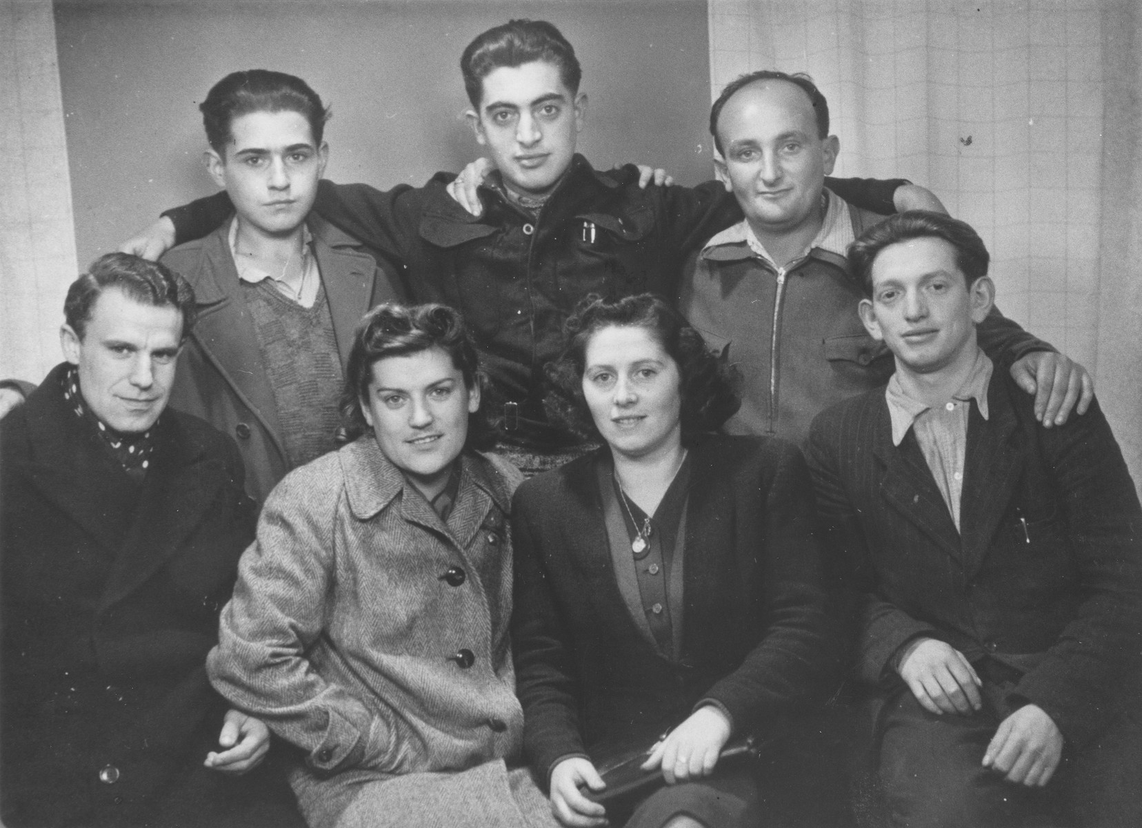 Shmuel Rakowski (top row, center) poses with a group of Jewish survivors from Mukachevo who he escorted out of Poland on a Bricha route.