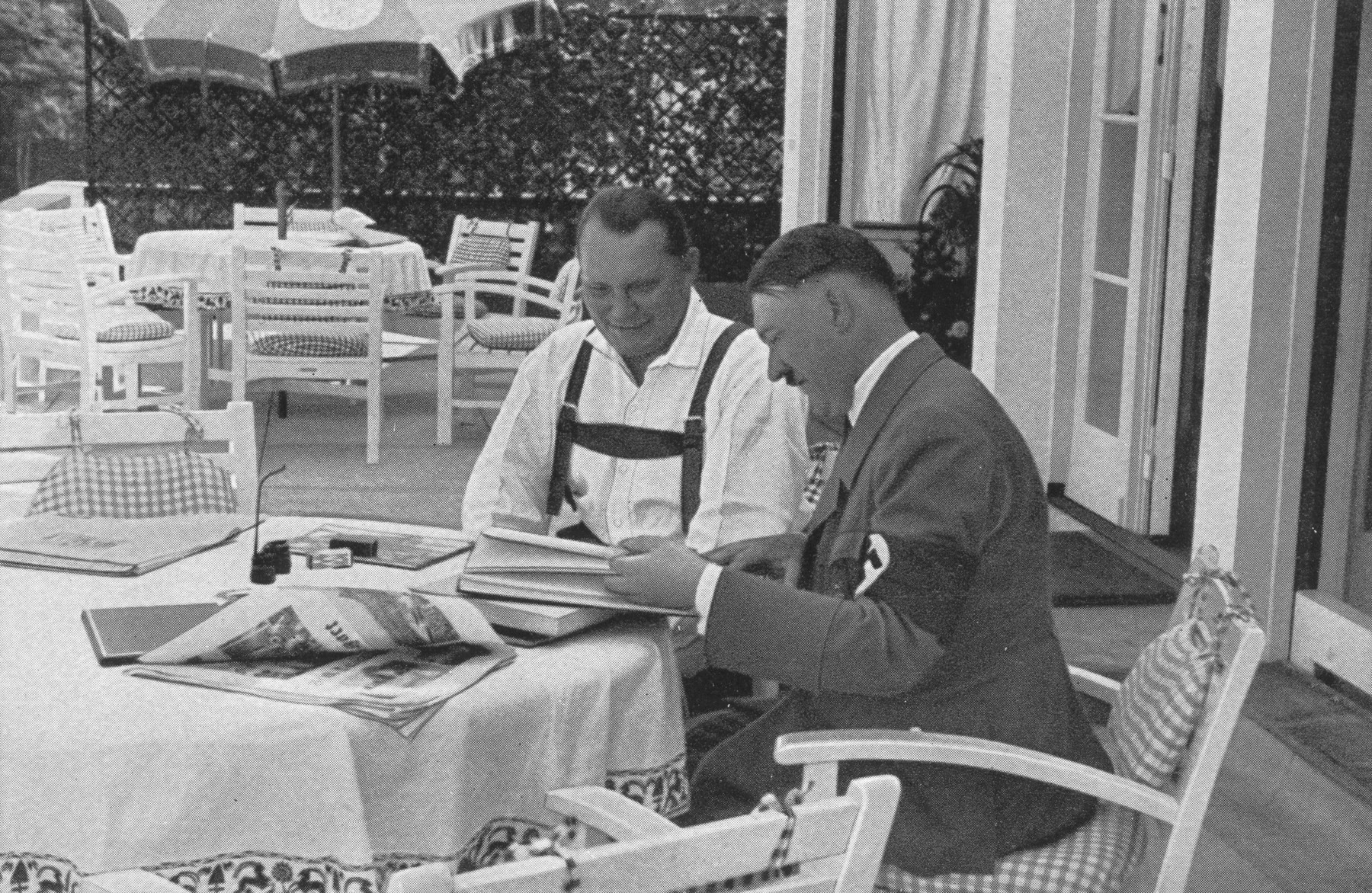 Minister-president Hermann Goering meets with Adolf Hitler on a terrace in the Obersalzberg.