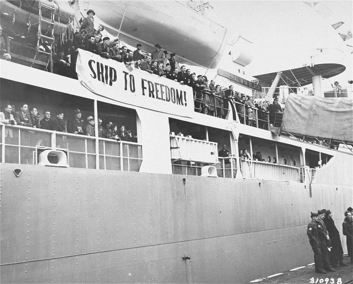 Displaced persons of various nationalities seeking to immigrate to the U.S. line the decks of the General Black as it leaves the port of Bremerhaven.
