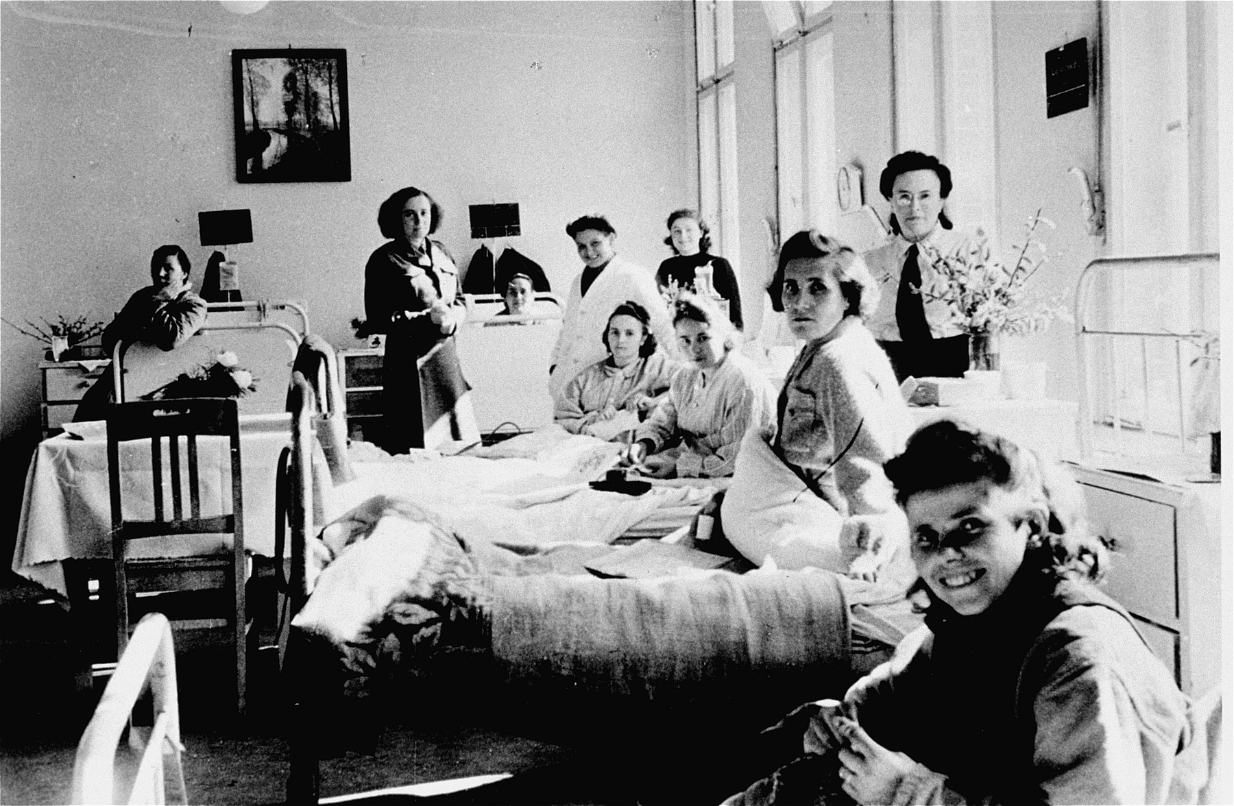 Women's ward of the hospital at the Bergen-Belsen DP camp.

The woman in the fourth bed from the right is Erzsabet Felberman Steiner. Both she and her sister Klara (originally from Gemzse, Hungary) survived Bergen-Belsen and remained there until they immigrated to Canada.   Pictured in the first bed in the front is is Franka Ptasznik Gertel from Lodz. She and her older sister were the only family members to survive the Auschwitz selection.
