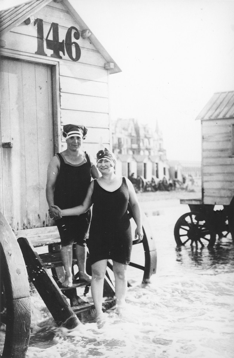 Two Belgian-Jewish women stand on the steps of a seaside cabana in Ostend.

Pictured are Ryfka Horowitz Halter (left) and a friend.