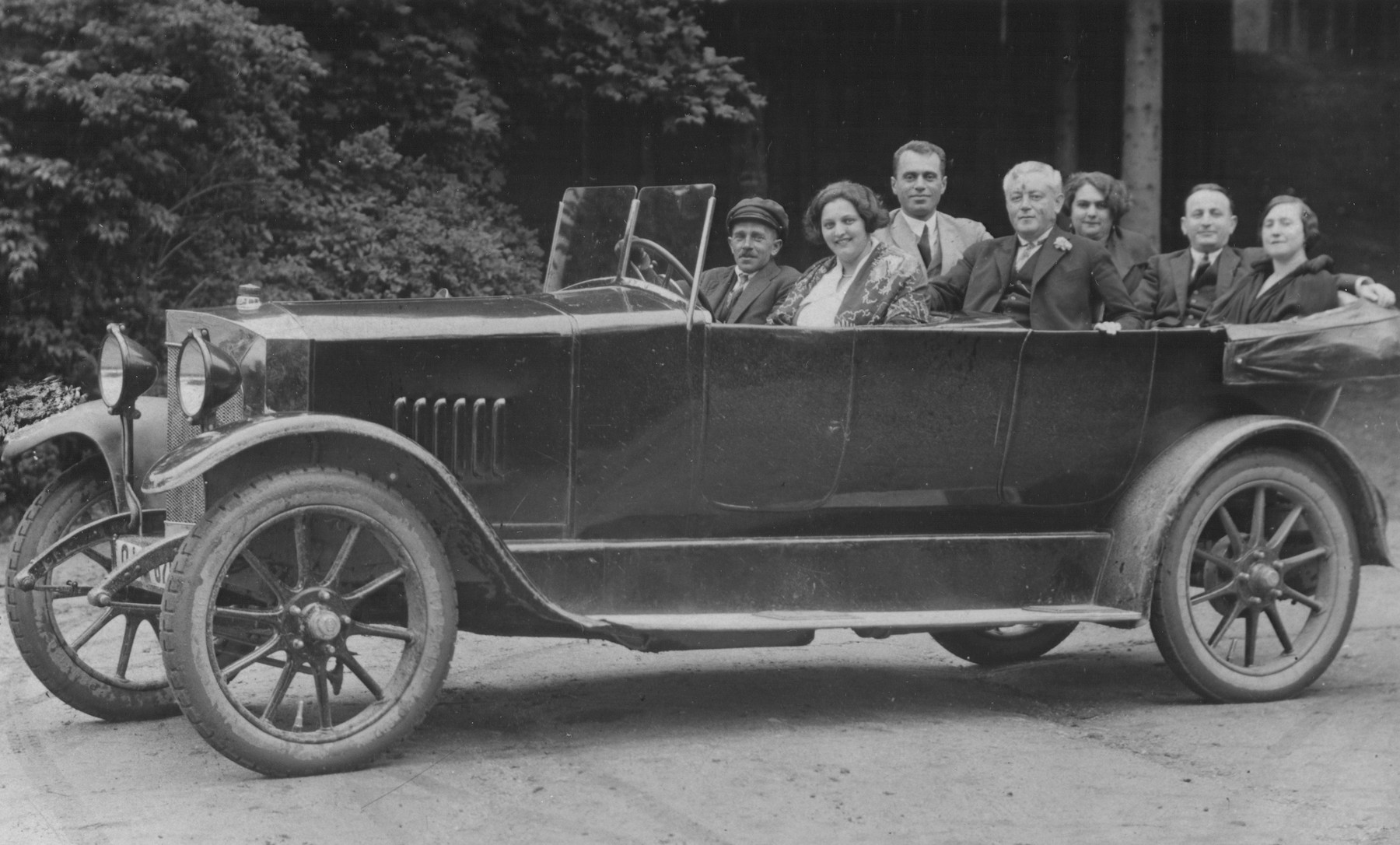 Hungarian Jews on vacation drive in an open automobile while vacationing in Marienbad.

Marci (Marton) Vecsey (uncle of the donor) is pictured in the center.